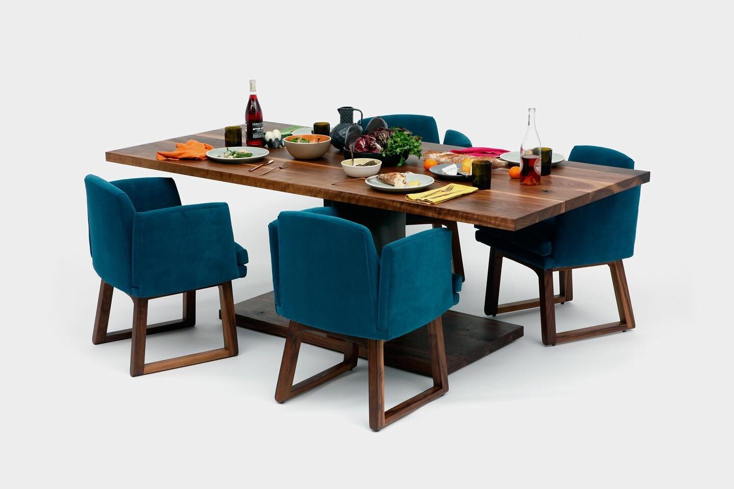 ARTLESS 2020 dining table in walnut and blackened steel is available in 60&rdquo;, 84&rdquo;, and 96&rdquo; for your family meals! Paired with Allison dining chairs in peacock aged velvet