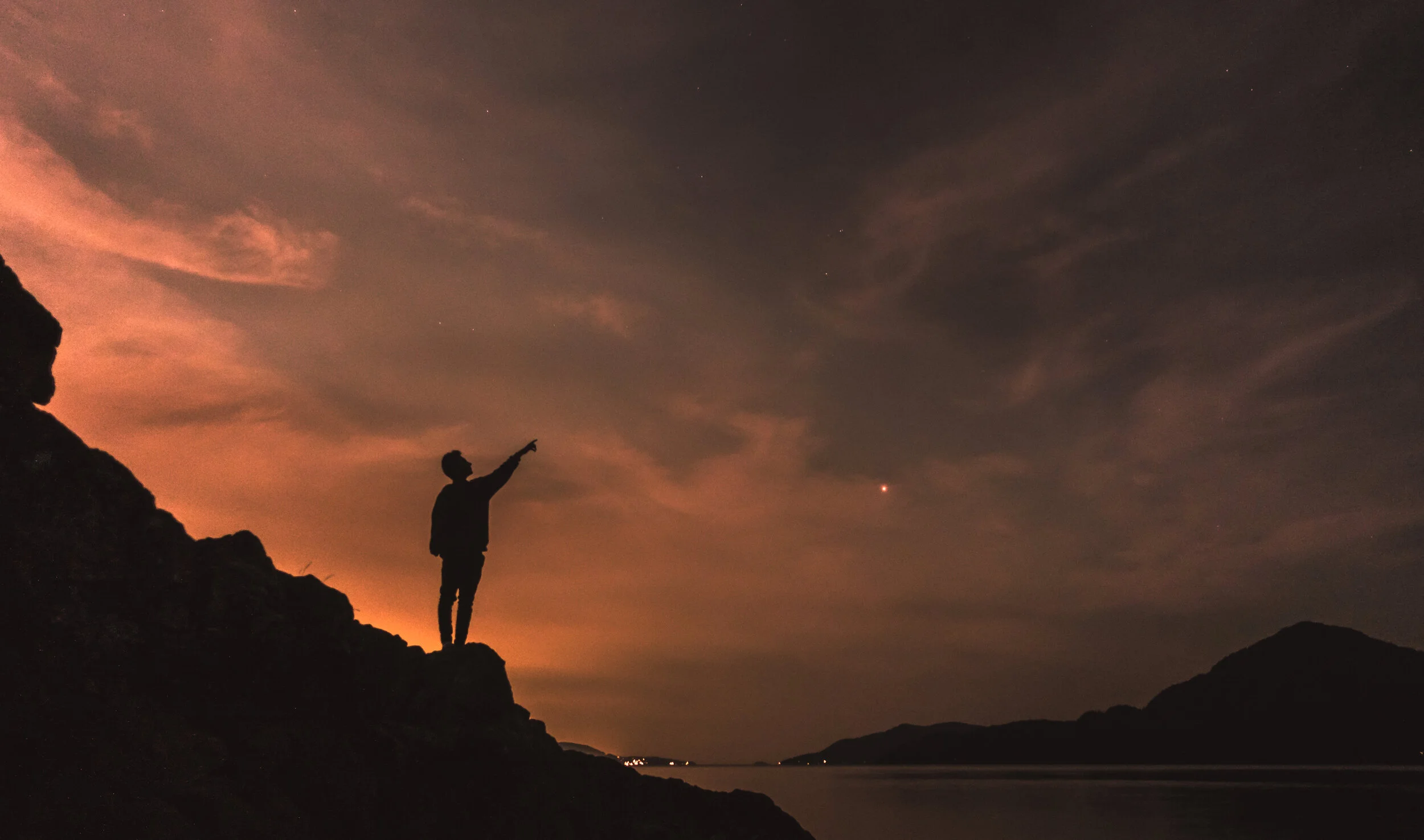 Person on a sunset with an orange sky
