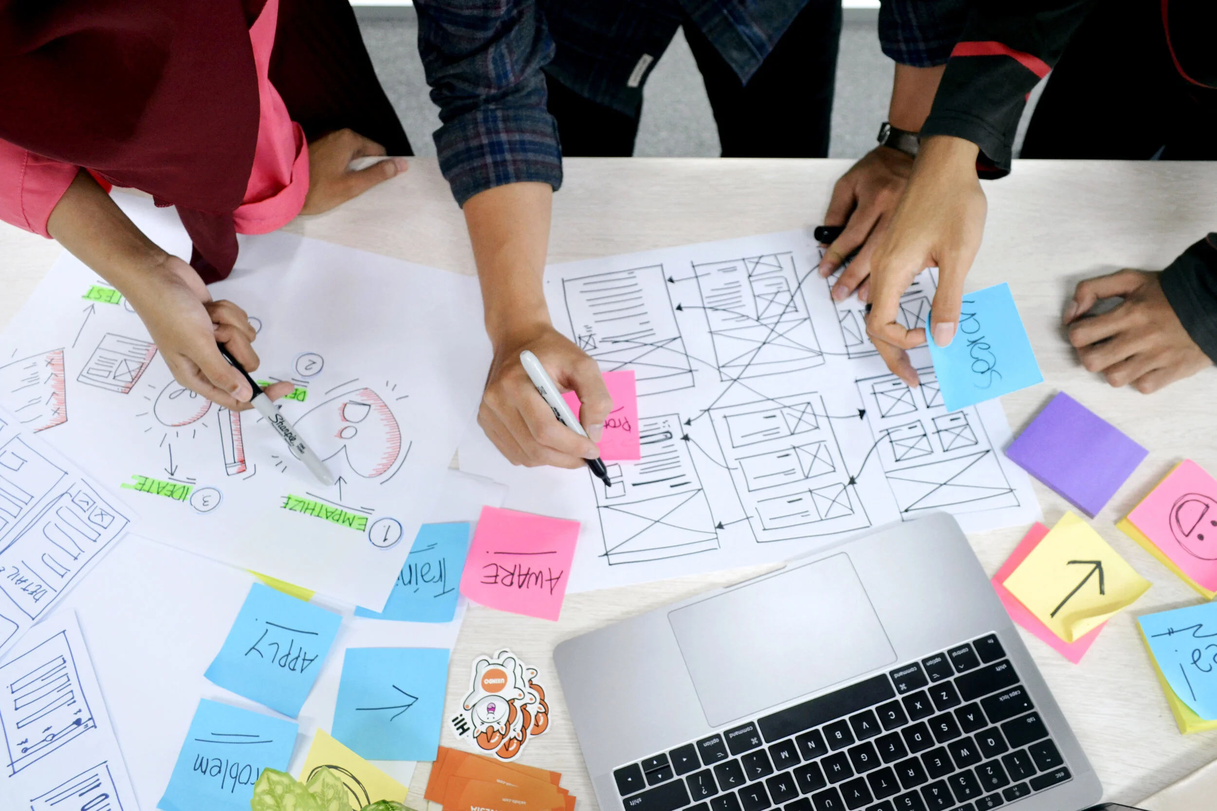 People working and drawing together in a workshop