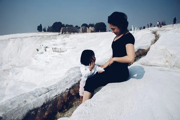 Pamukkale basins in the back, hot spring waters flowing through our legs
