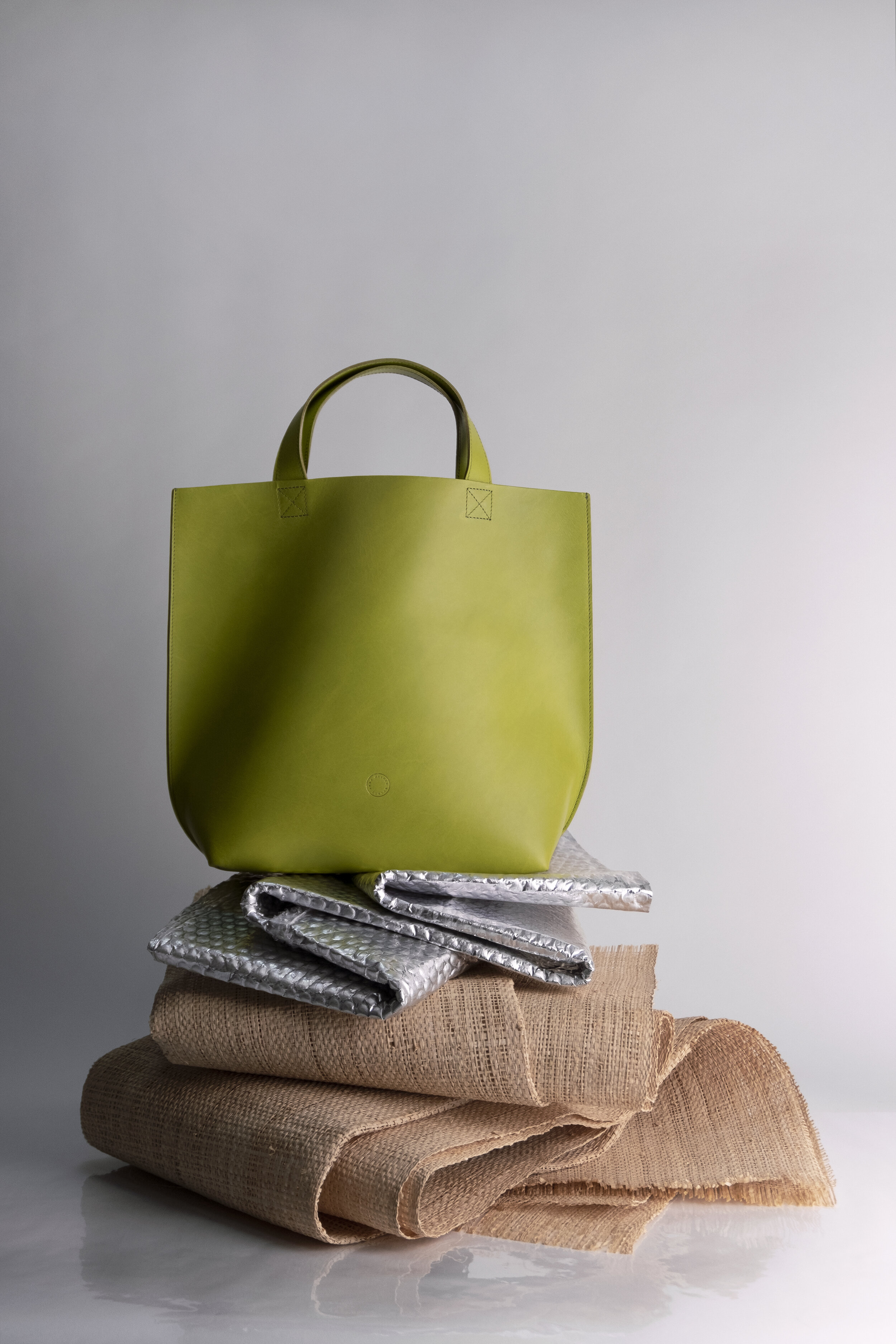 albertine-tucknott-stylist-still-life-leather-bag-green-sculpture.jpg