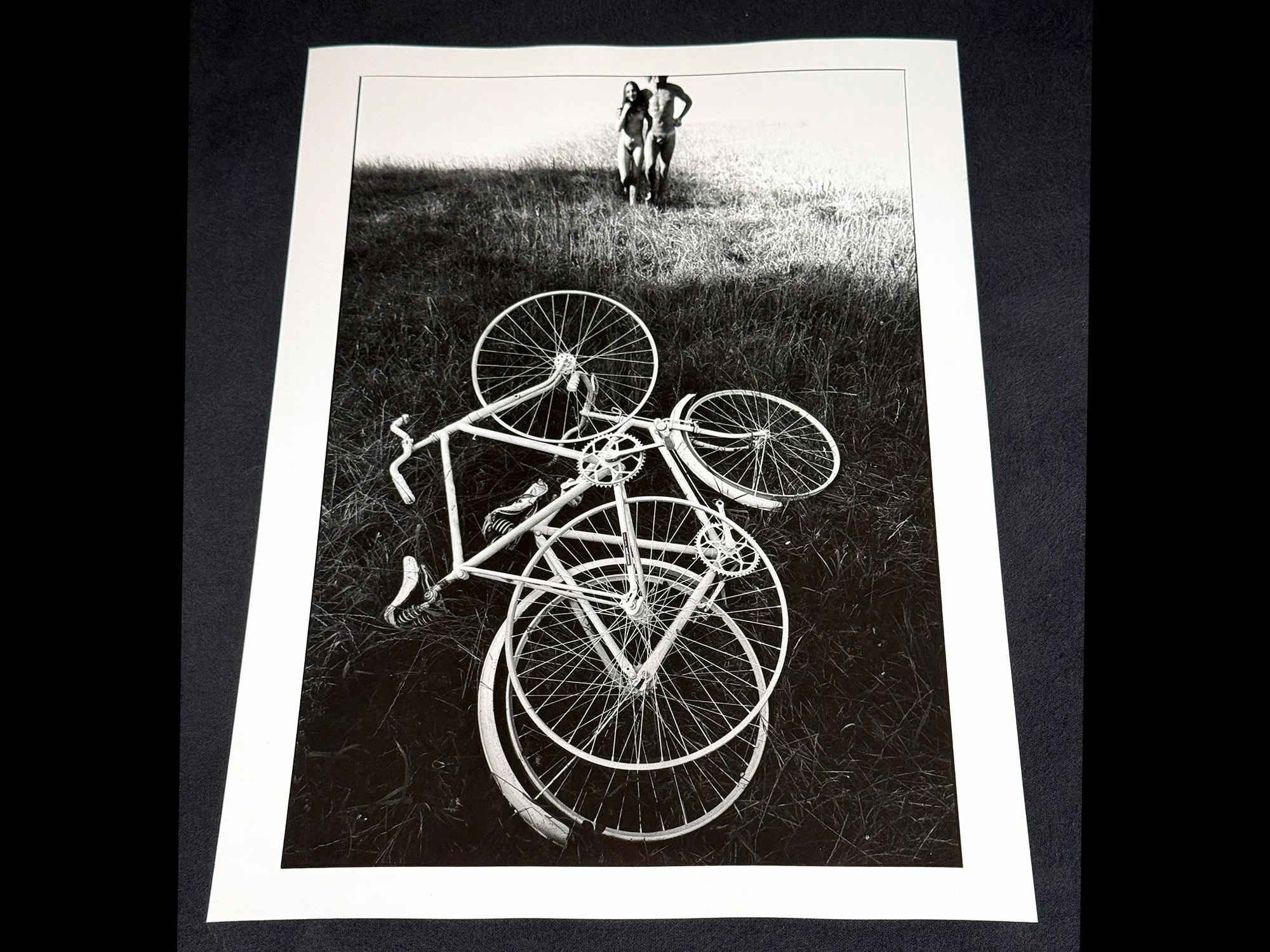 Two-Lovers-with-Bikes-Arm-in-Arm-Recto-PIN-58237-1500-Format-SqSp.jpg
