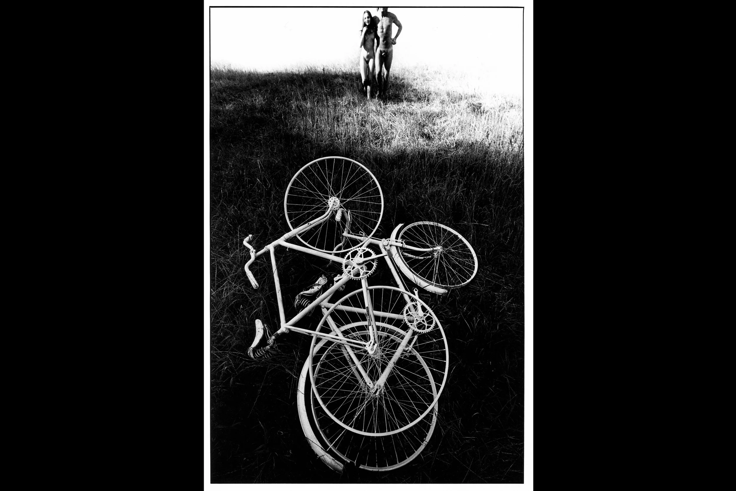 Two Lovers With Bikes - walking arm-in-arm