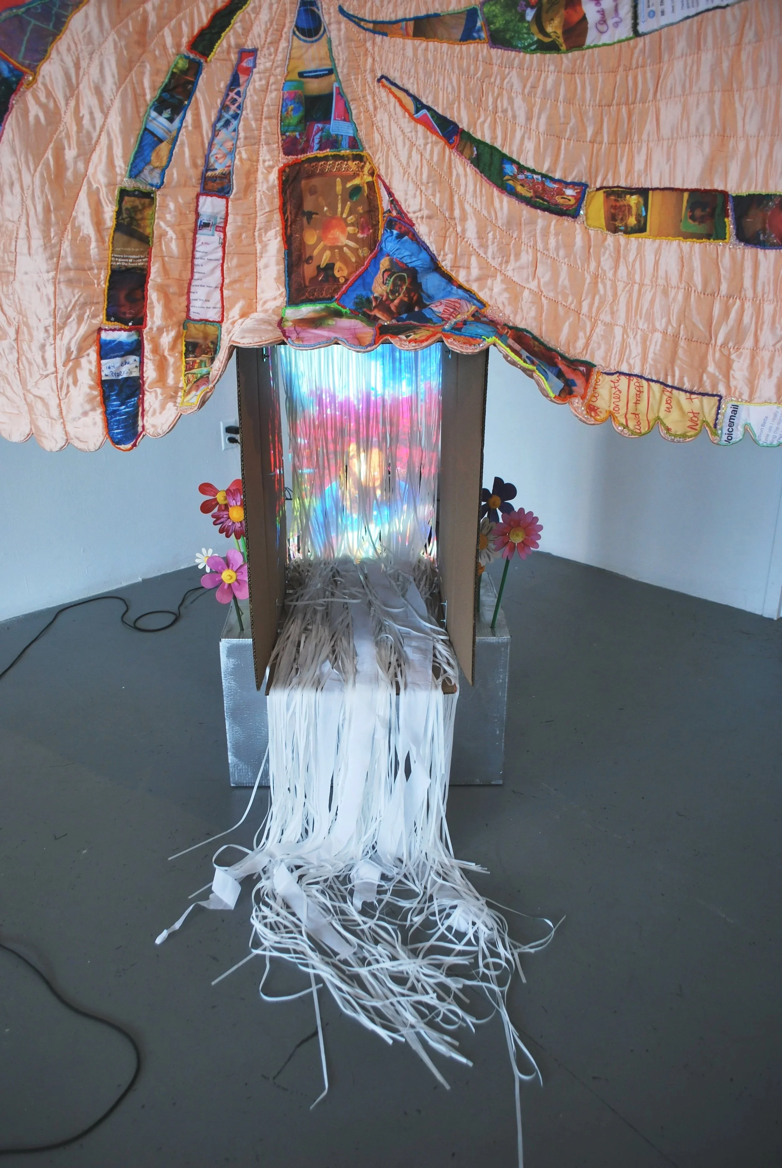 Projection detail from Party/Monster multimedia installation featuring layered imagery and stitched fabric elements.