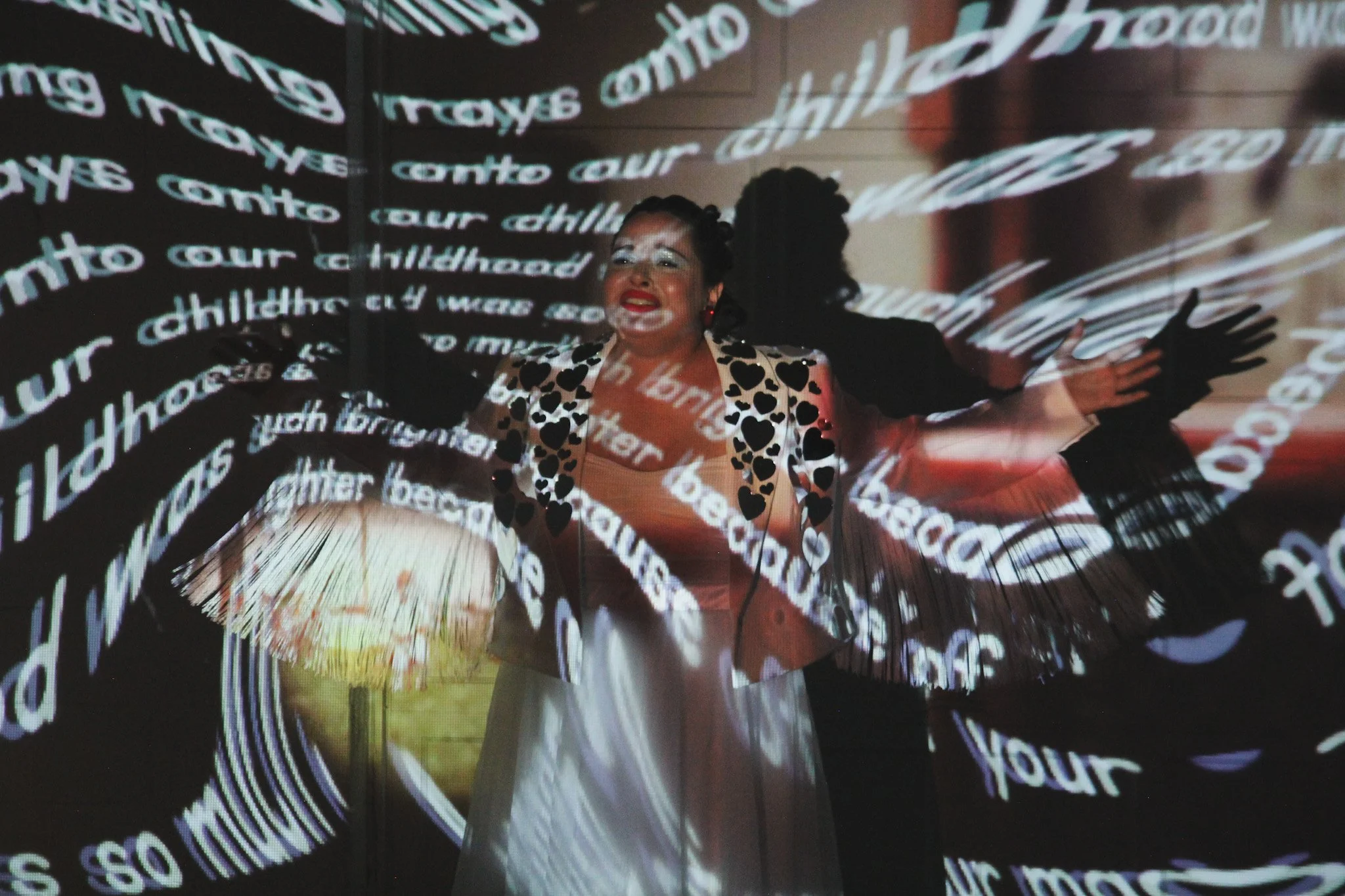 Multimedia installation infinitlovalie by Lauren Be Dear featuring altered dollhouse projections and family archive footage.