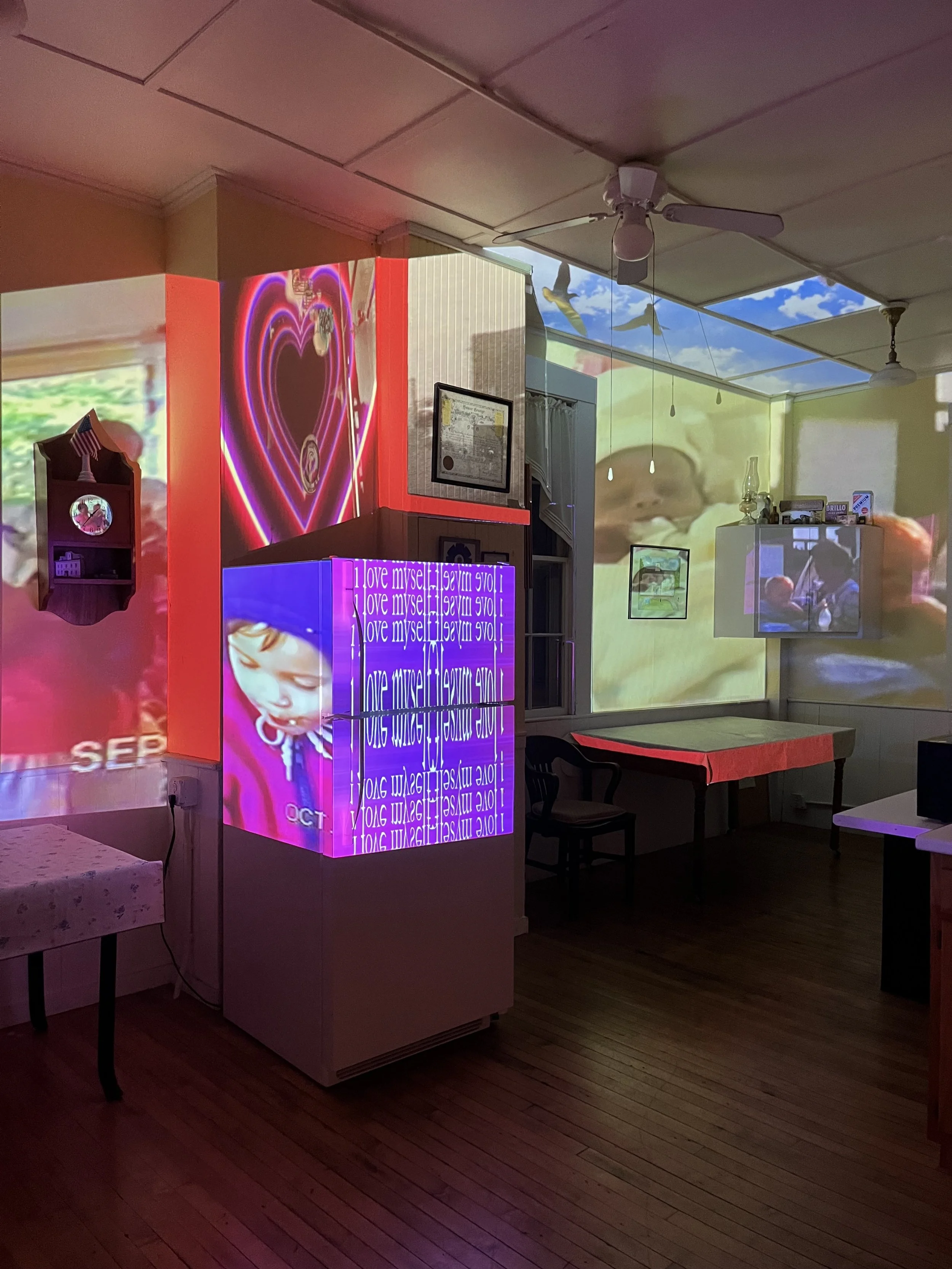 Projection mapped video installation detail featuring layered home movie imagery and abstract video textures.