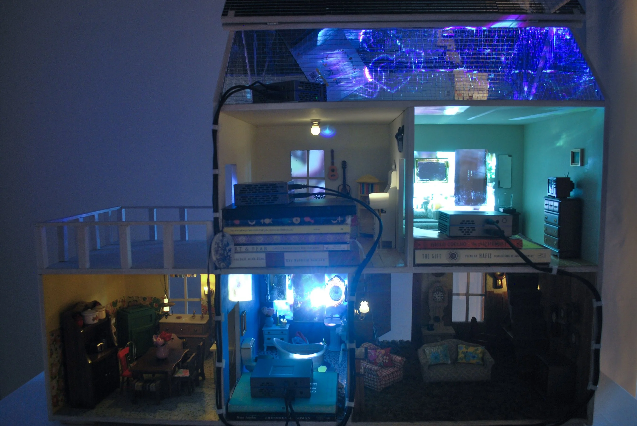 Gallery installation view of infinitlovalie multimedia environment exploring grief, tenderness, and family history.