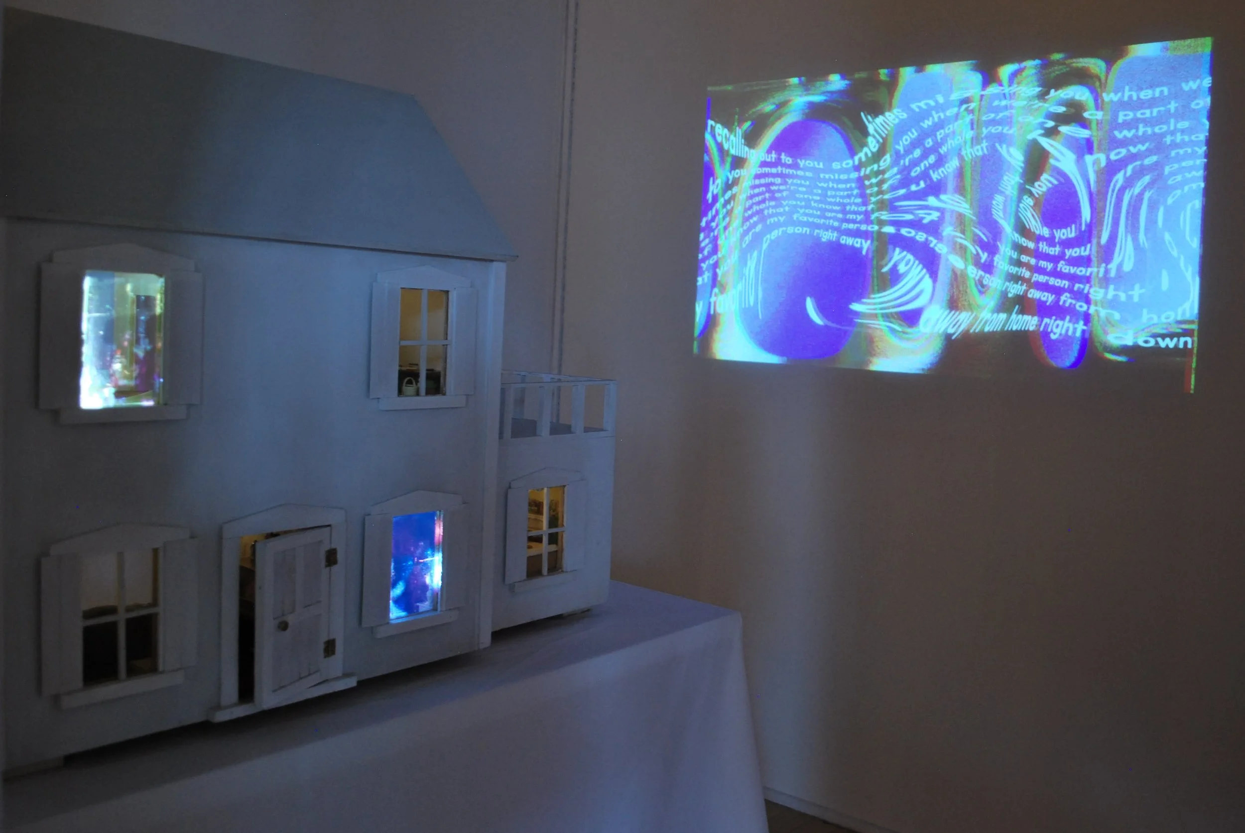 Immersive installation using home movies, poetry, and projection to explore memory, care, and emotional inheritance.