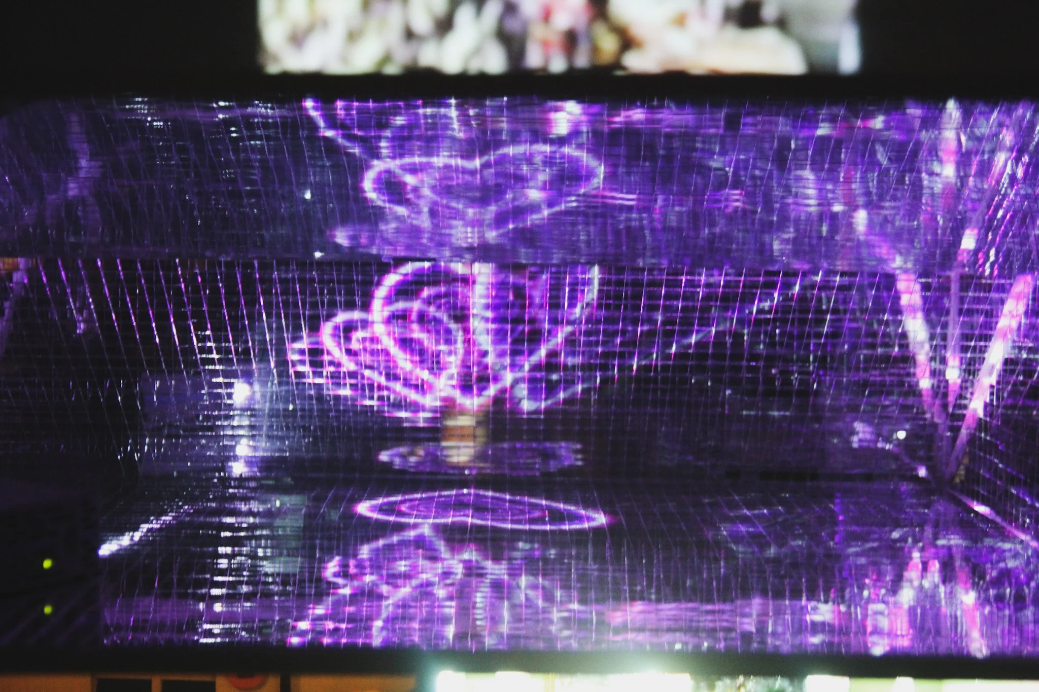Video installation detail from infinitlovalie featuring layered family imagery and projection mapping.