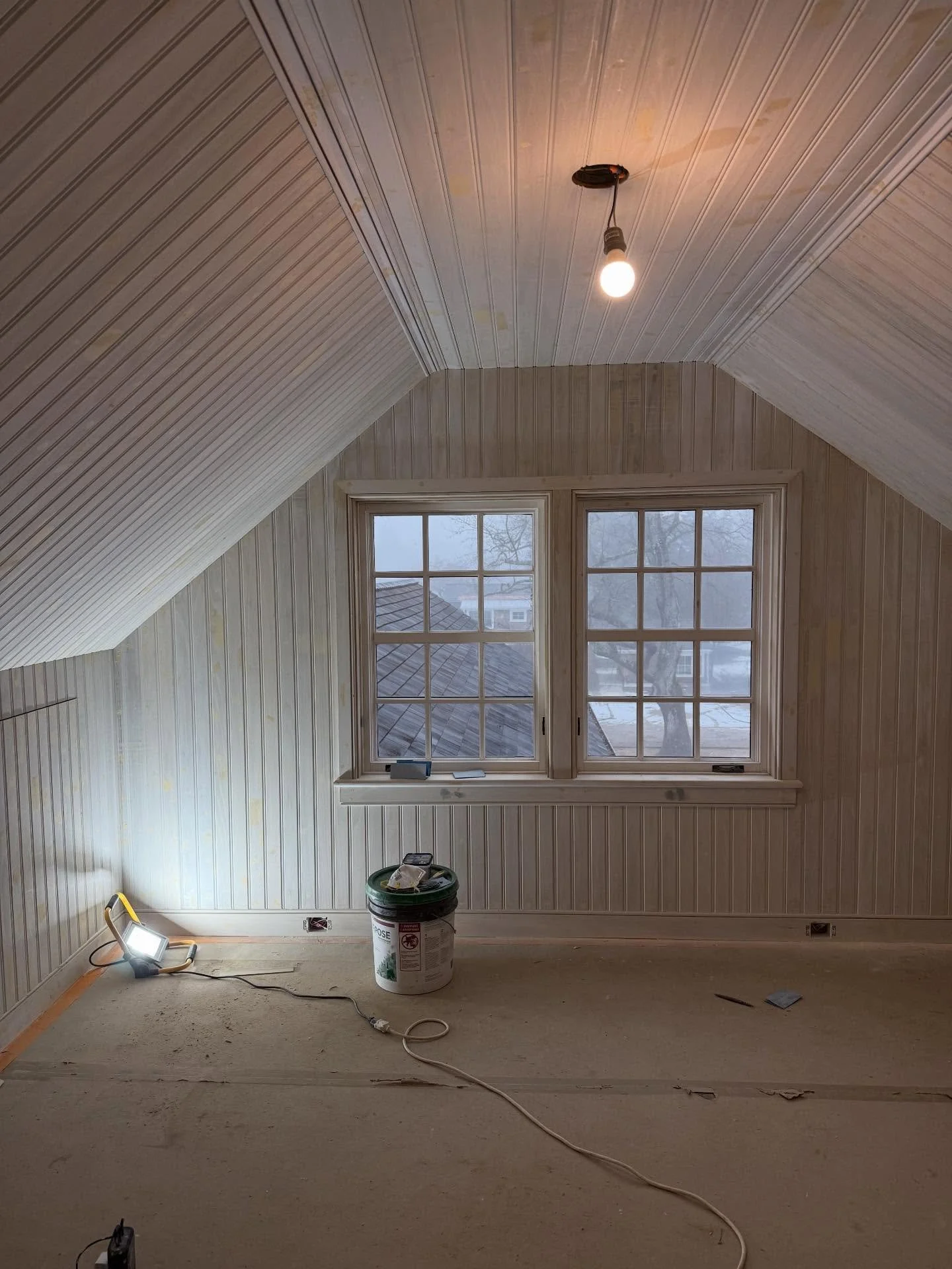 It&rsquo;s cozy in this third floor, East Hampton bedroom despite the snow and rain today.  The new beadboard and trim work adds such nice depth and interest to this tiny space.  #shinglestylehouse #gutrenovation #savealltheoldhouses