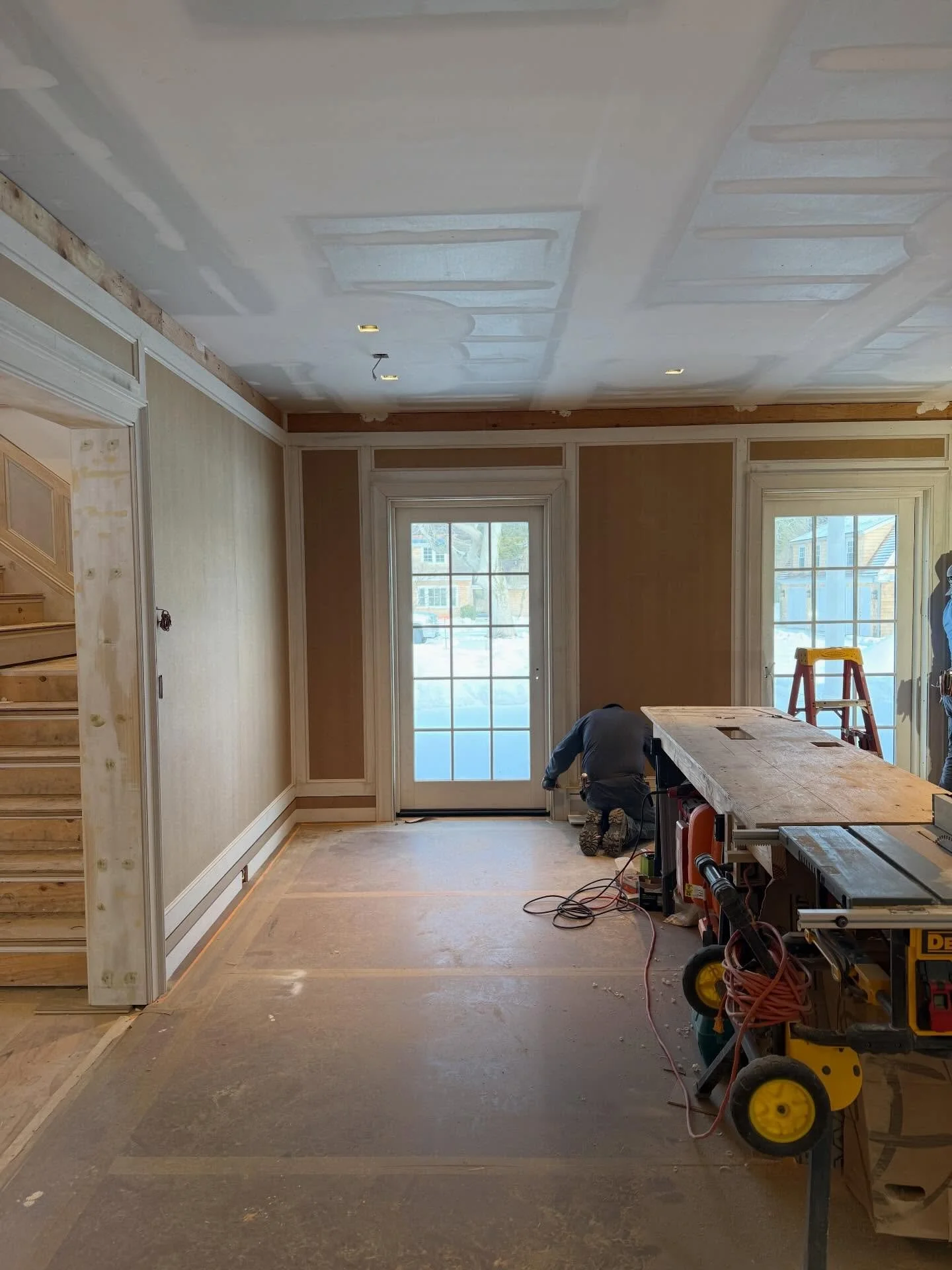 Prior to demolition our East Hampton living room had zero character and an ugly fireplace.  It&rsquo;s leveling up with custom paneling, beams, and the most beautiful green marble.  Such good progress this week.  @kellyrosendesign #shinglestylehouse 