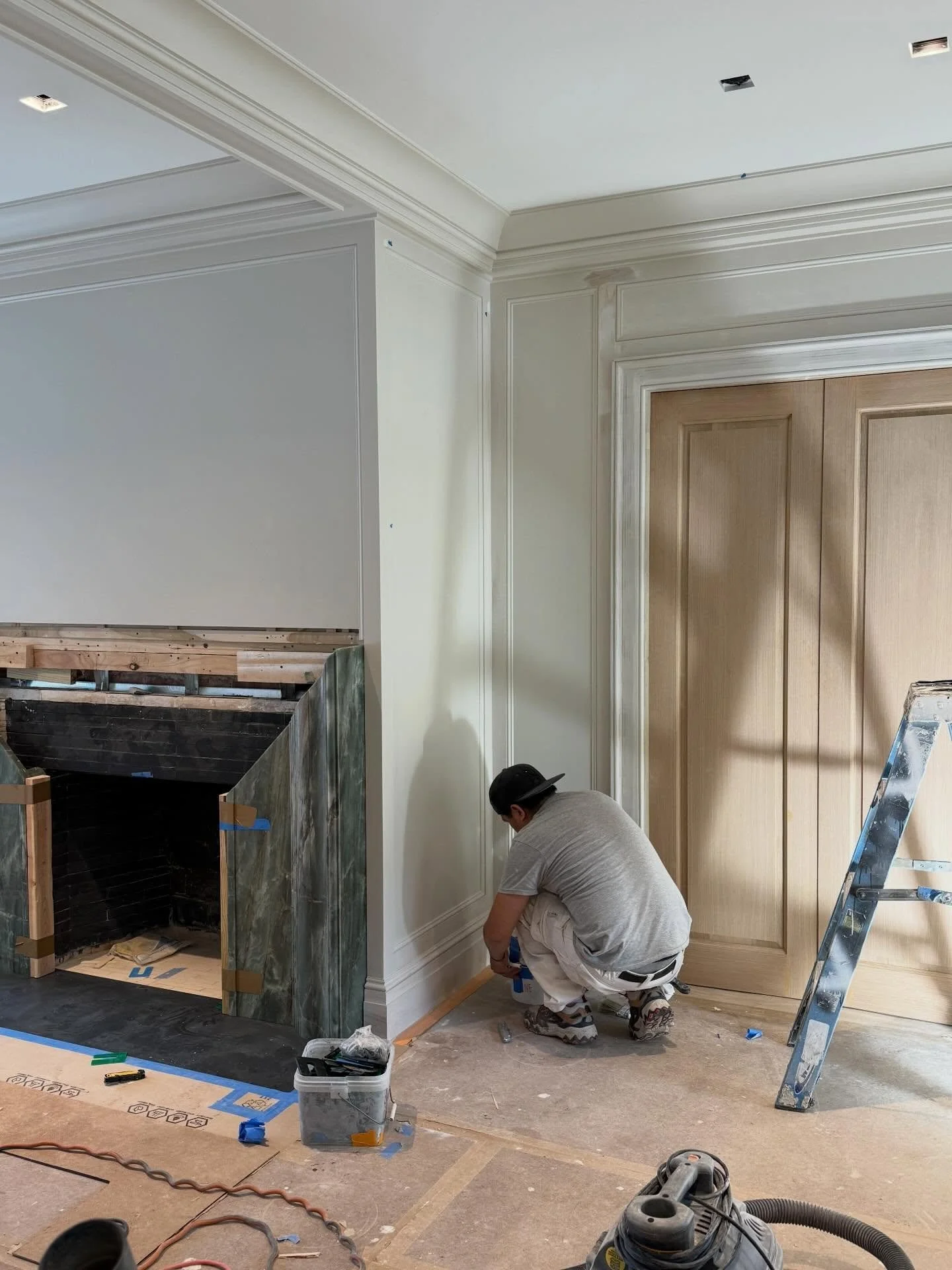 Coming together in East Hampton!  White oak doors, paneled walls, coffered ceiling, and a beautiful stone fireplace surround.  Love working with @kellyrosendesign and Gentry Construction #easthampton #gutrenovation #shinglestylehouse #savealltheoldho