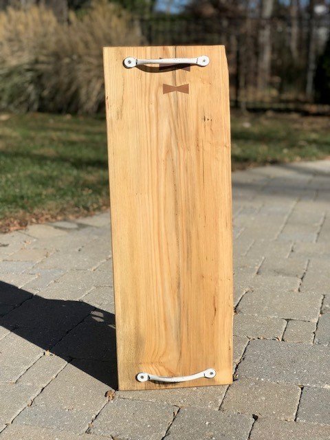 Description: Ash serving board with white handles. 29" L x 10" W
Price: $50