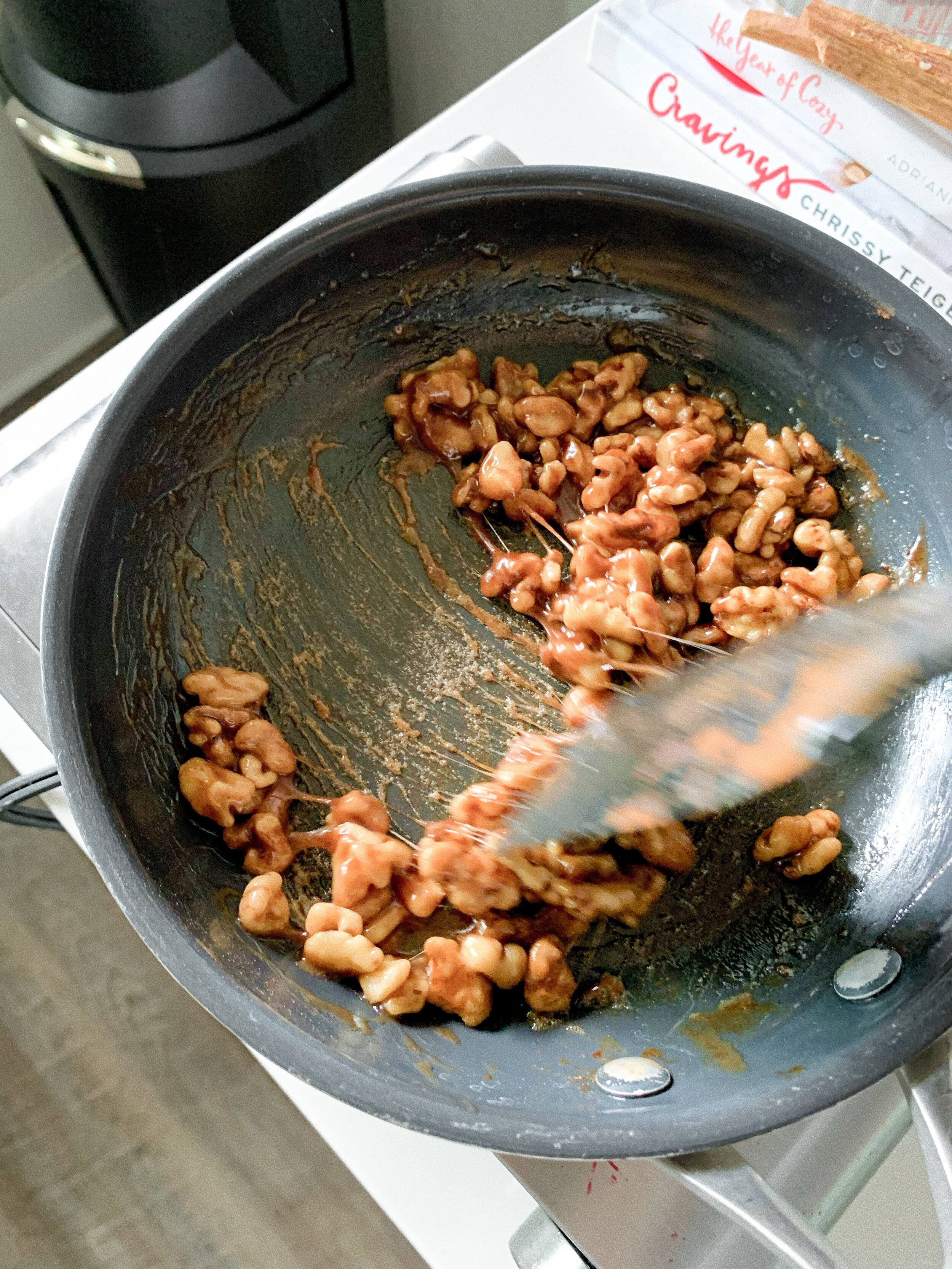 Making the candied walnuts in a separate saucepan