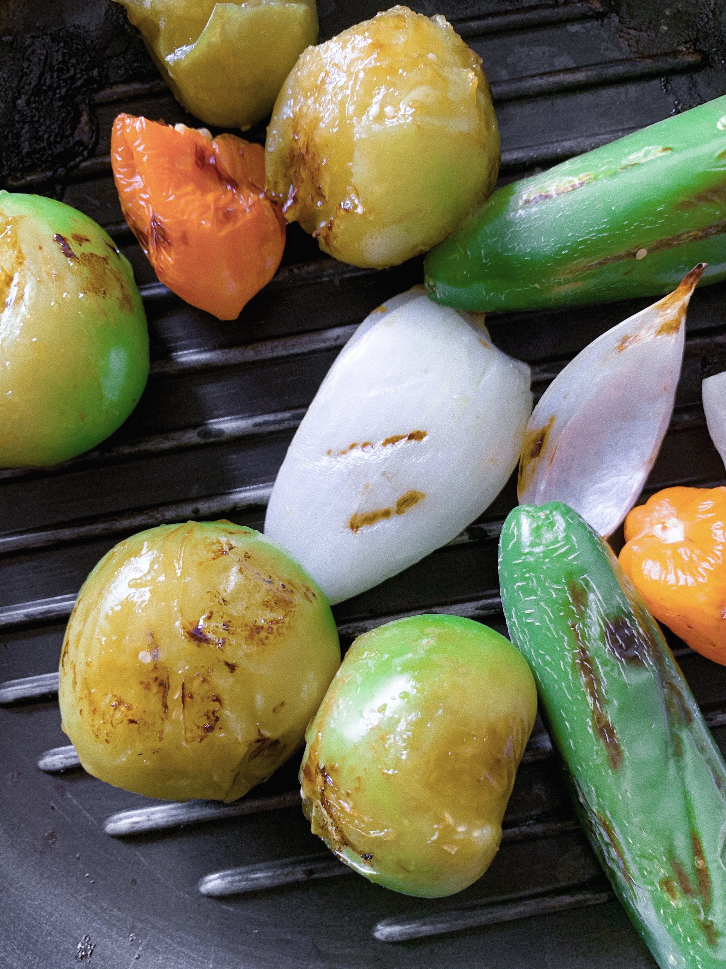 The salsa verde ingredients roasting on the stovetop