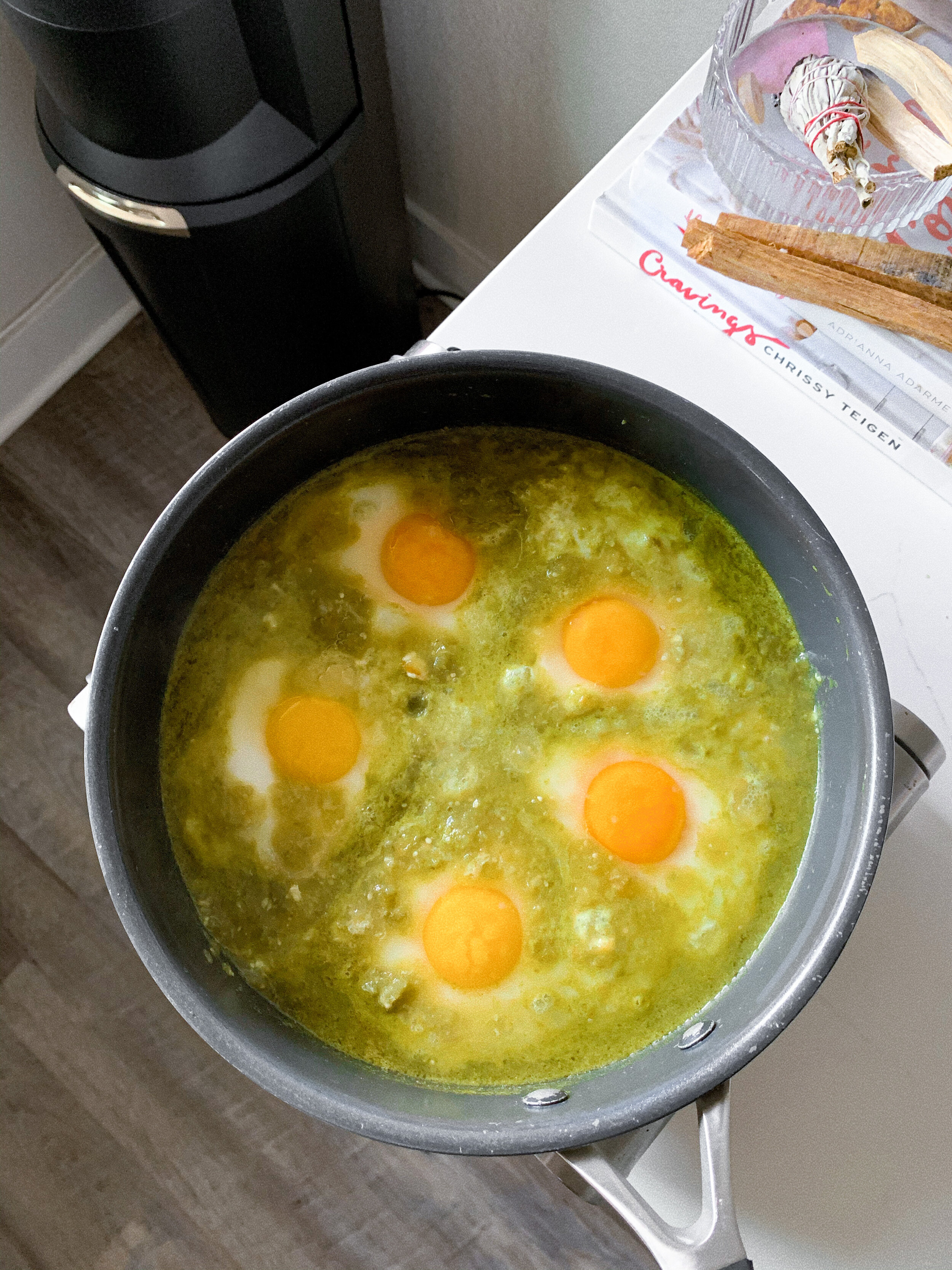 Poaching the eggs in the salsa verde until desired doneness