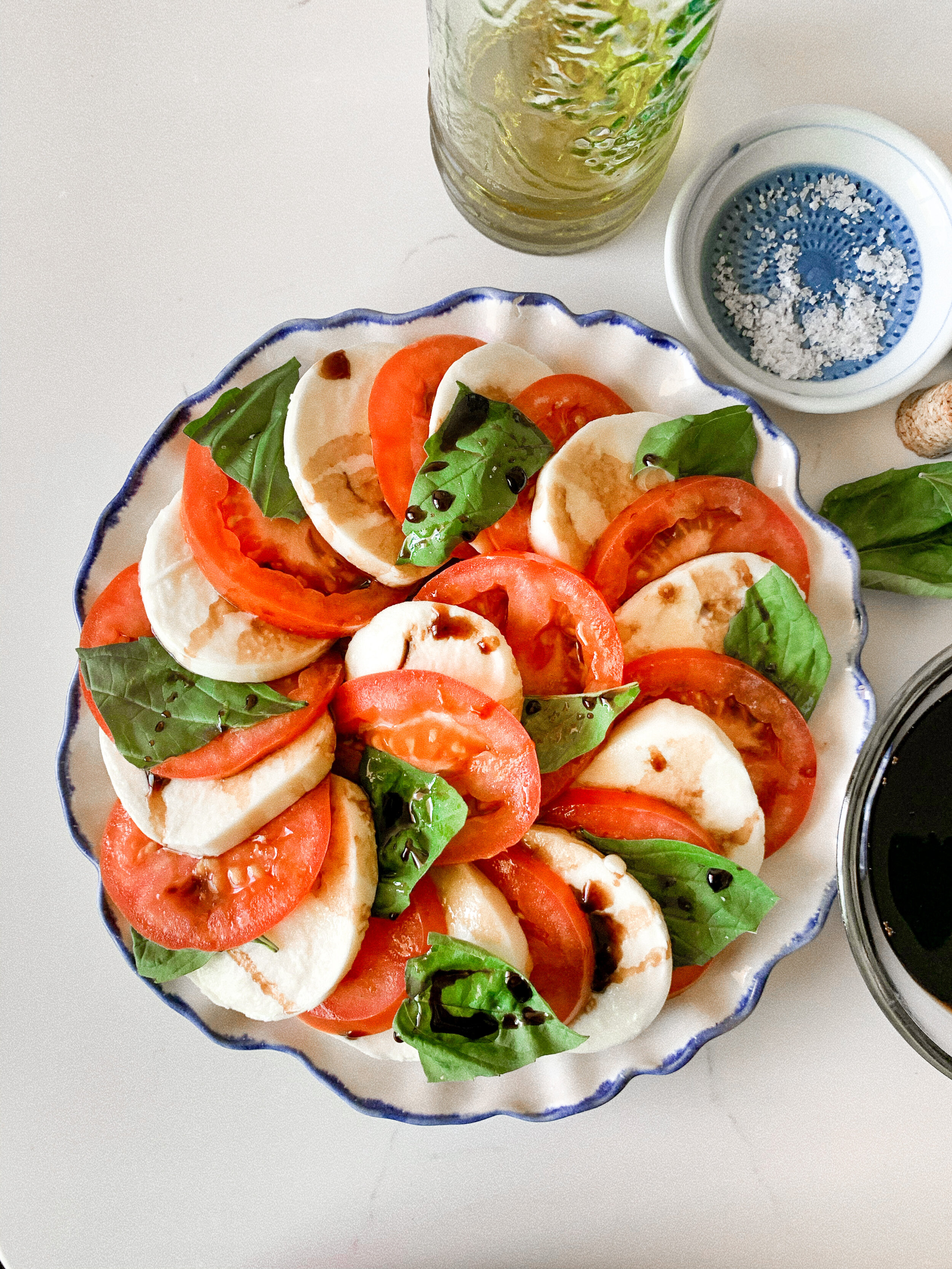 The prepped and plated caprese salad with homemade balsamic glaze