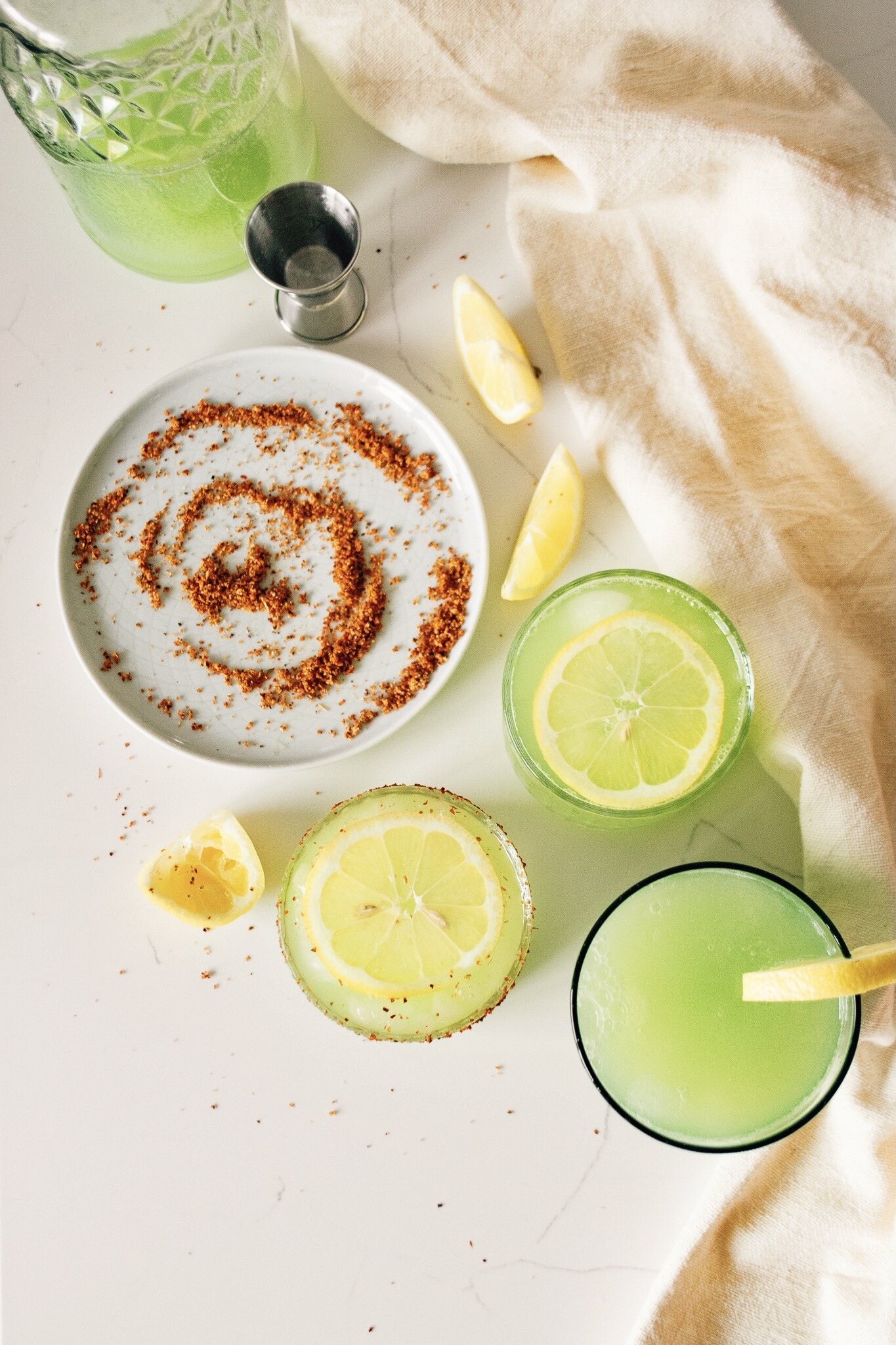 Agua de Pepino with lemon and salted rim on table