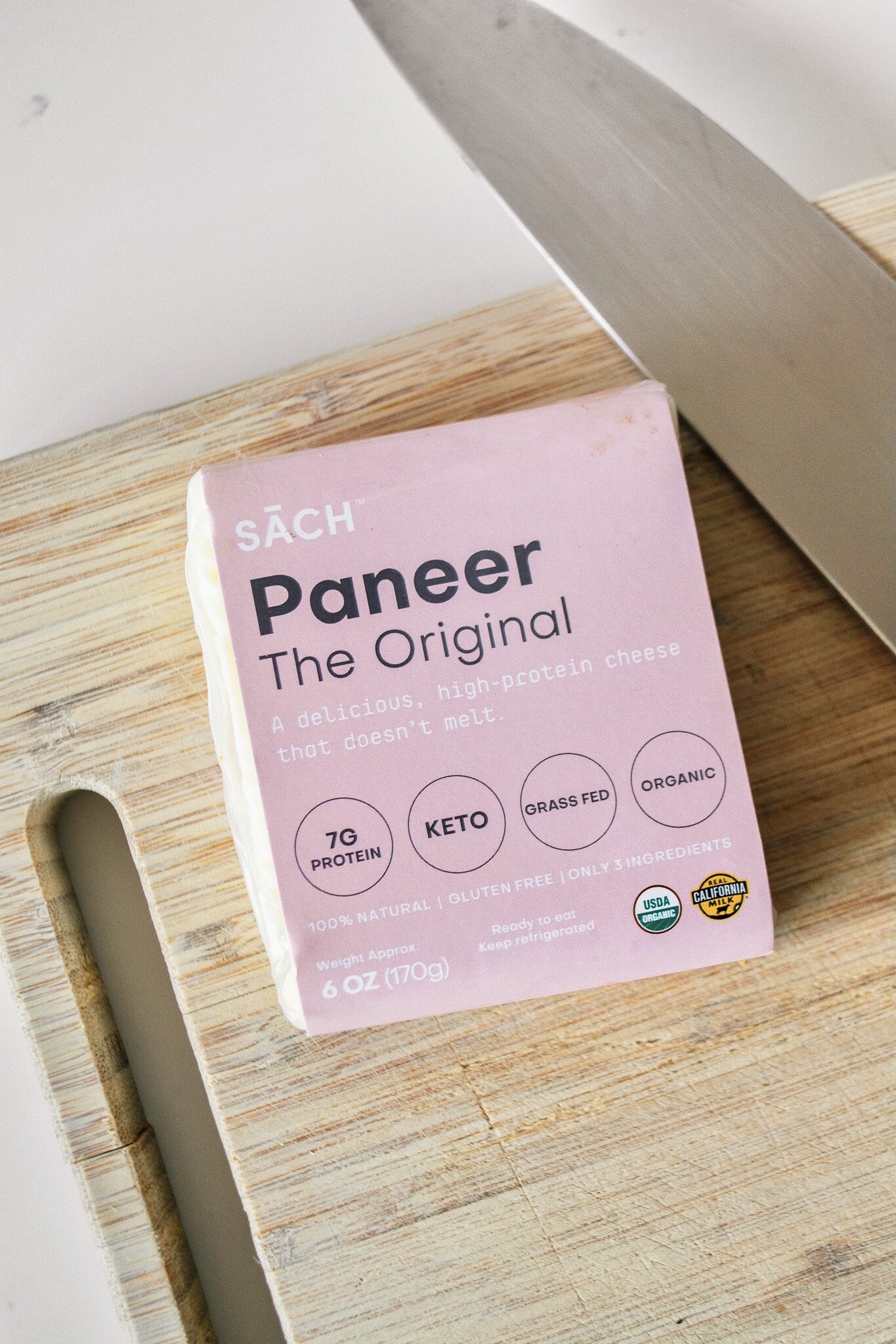 Packaged Paneer on cutting board