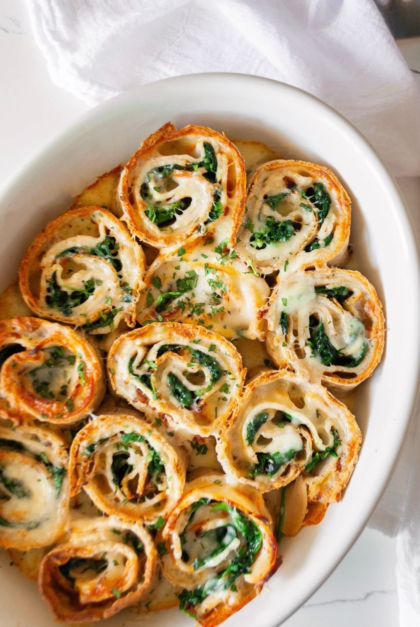 Cheesy Baked Turkey and Spinach Pinwheels out of the oven
