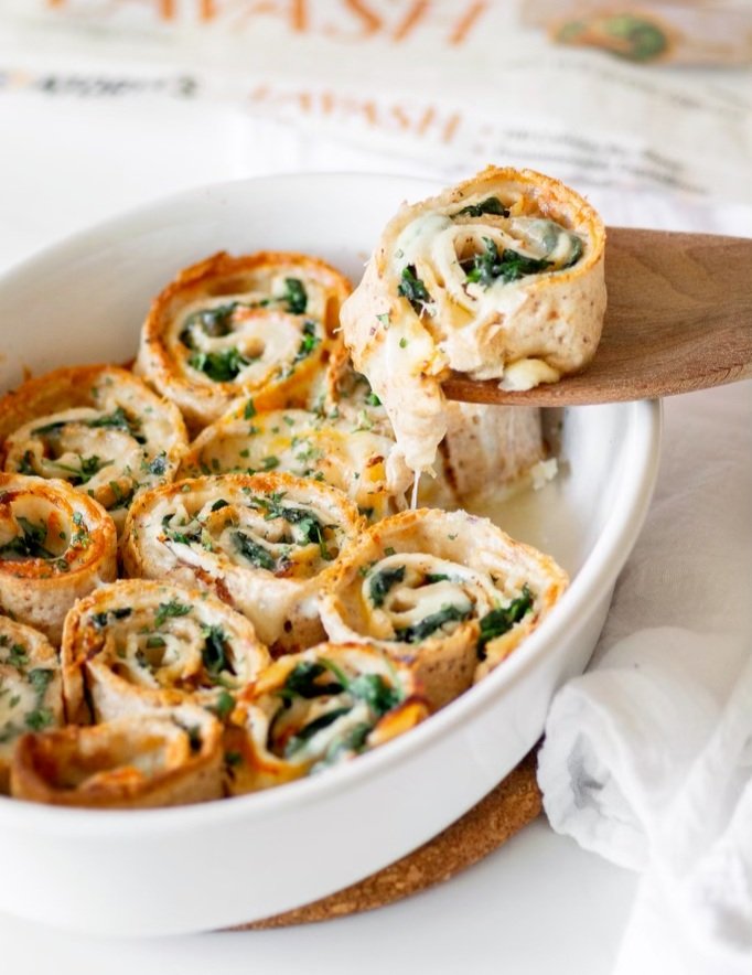 Serving Cheesy Baked Turkey and Spinach Pinwheels