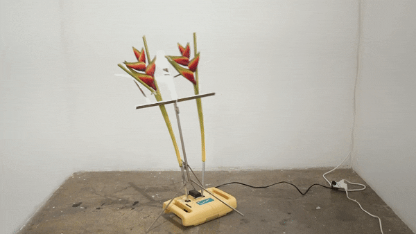 Rachel Youn,  10,000 hours,  2022, Shiatsu massager, artificial plants, wire stand, flower frogs, 39 x 24 x 20 1/2 in.