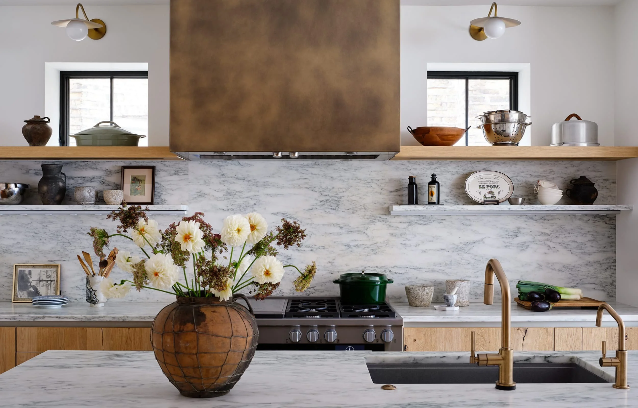 New kitchen with wooden cabinets and a flower vase on the island