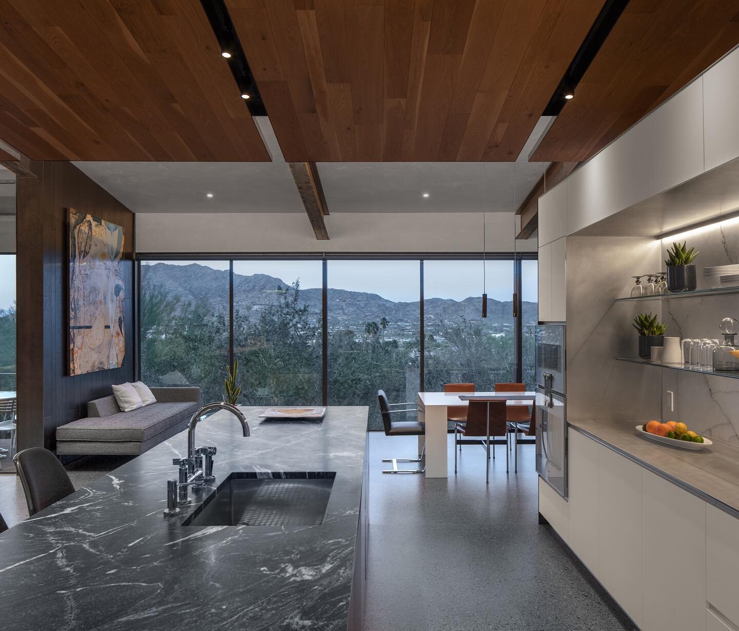 This custom kitchen crafted by @akstudioaz at our cliffback residence features stone countertops and backsplash from picasso tile as well as a full gaggenau appliance package.

🏠 design/build by @czphx 
📷 photography by bill timmerman