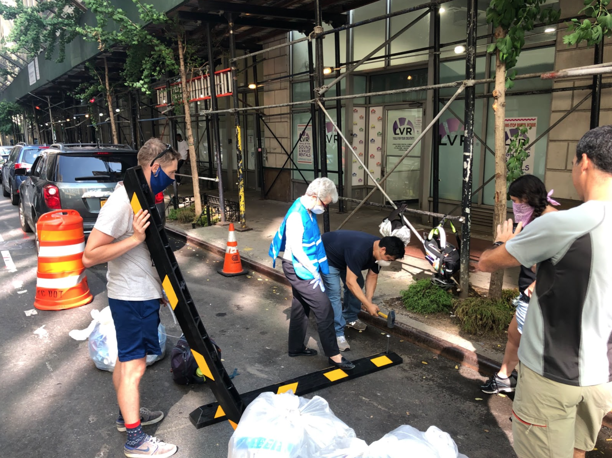 Open Plans Team with CHEKPEDS co-founder, Christine Berthet, building a trash corral in Hell’s Kitchen. July 2020. 