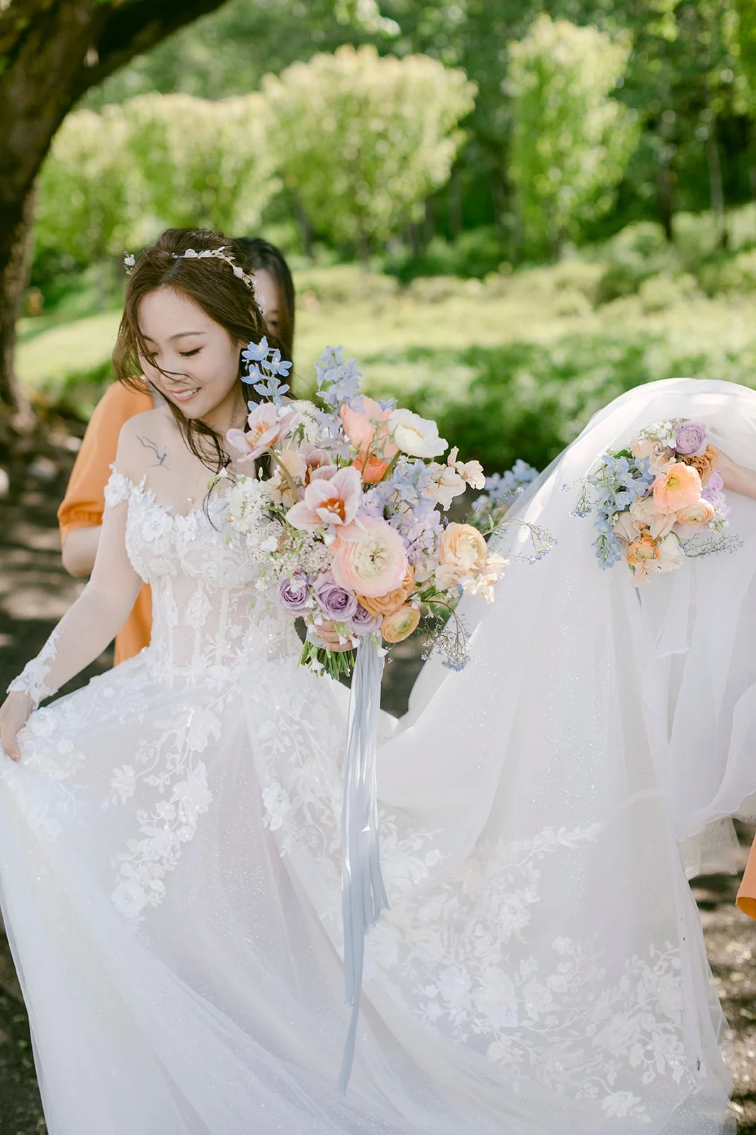 Lovely Bride Holding Whimsical Pastel Floral Bouquet.JPG