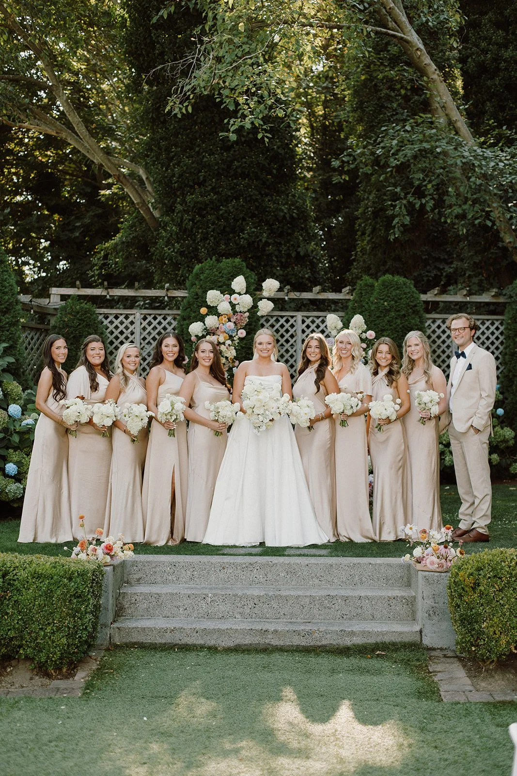 Bride and Bridesmaids Holding Whimsical Bouquets with White Hydrangeas.jpeg