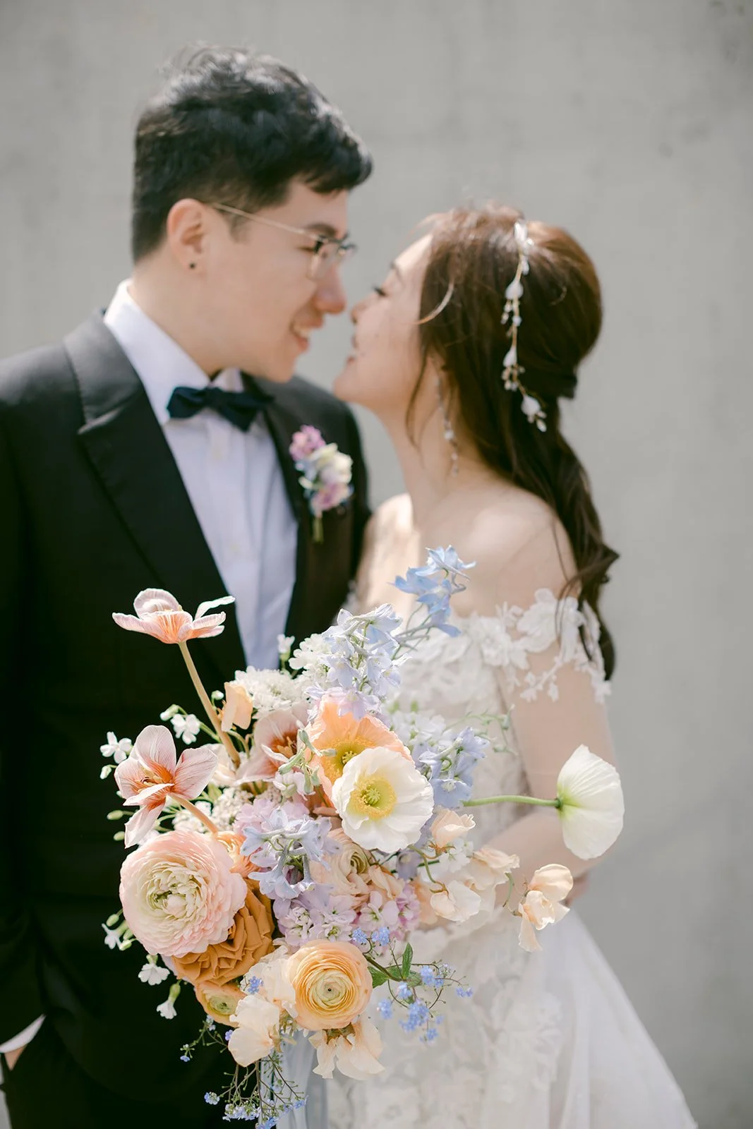 Bride and Groom Holding Whimsical Pastel Spring Wedding Bouquet.JPG