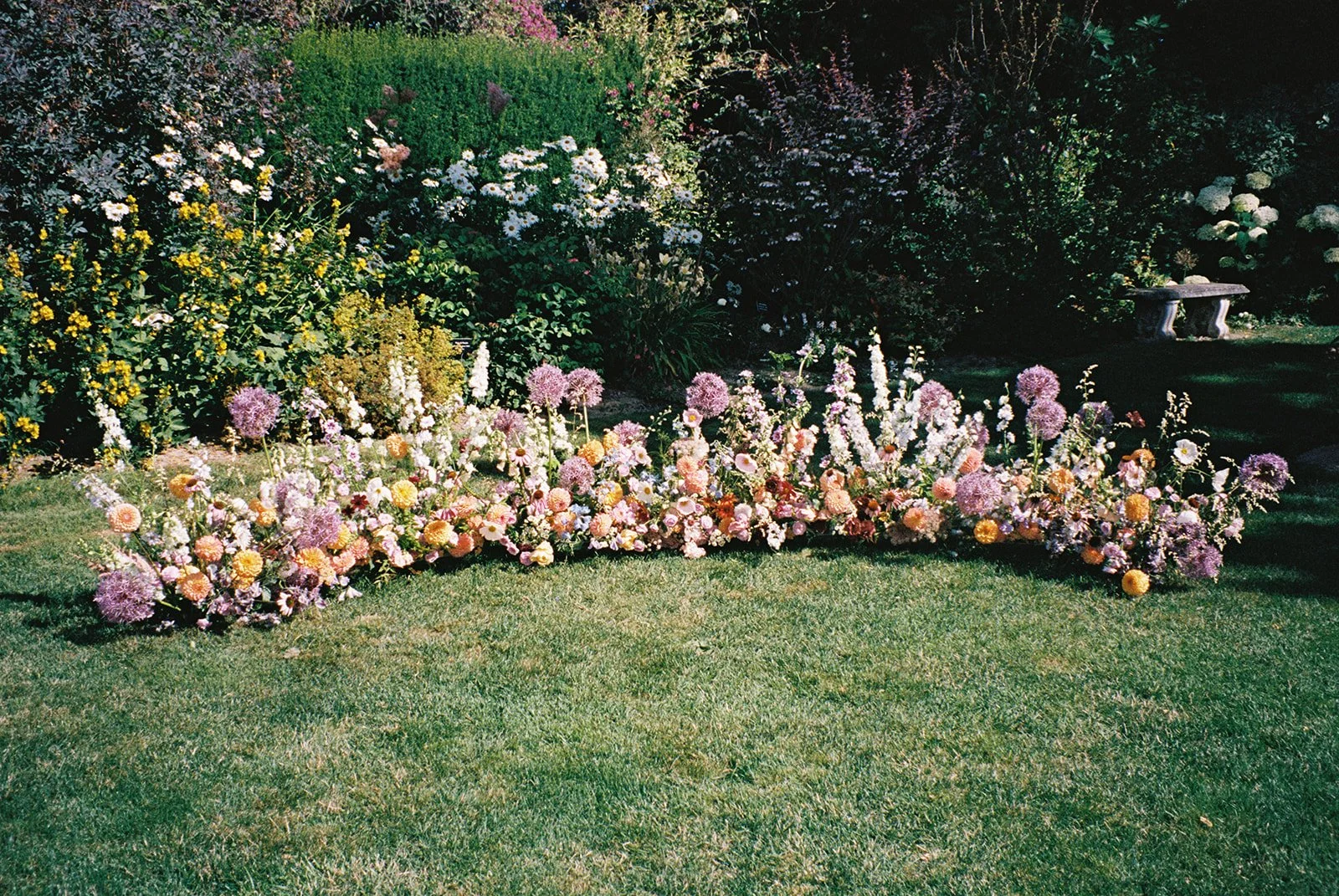 Joyful Pastel Grounded Ceremony Floral Arrangement.jpeg