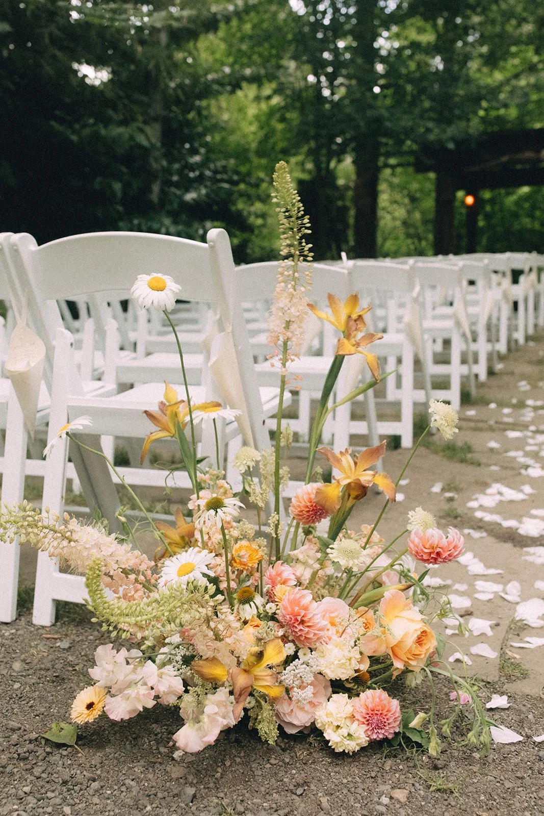 Whimsical Grounded Aisle Floral Arrangement with Daisies and Iris.JPG