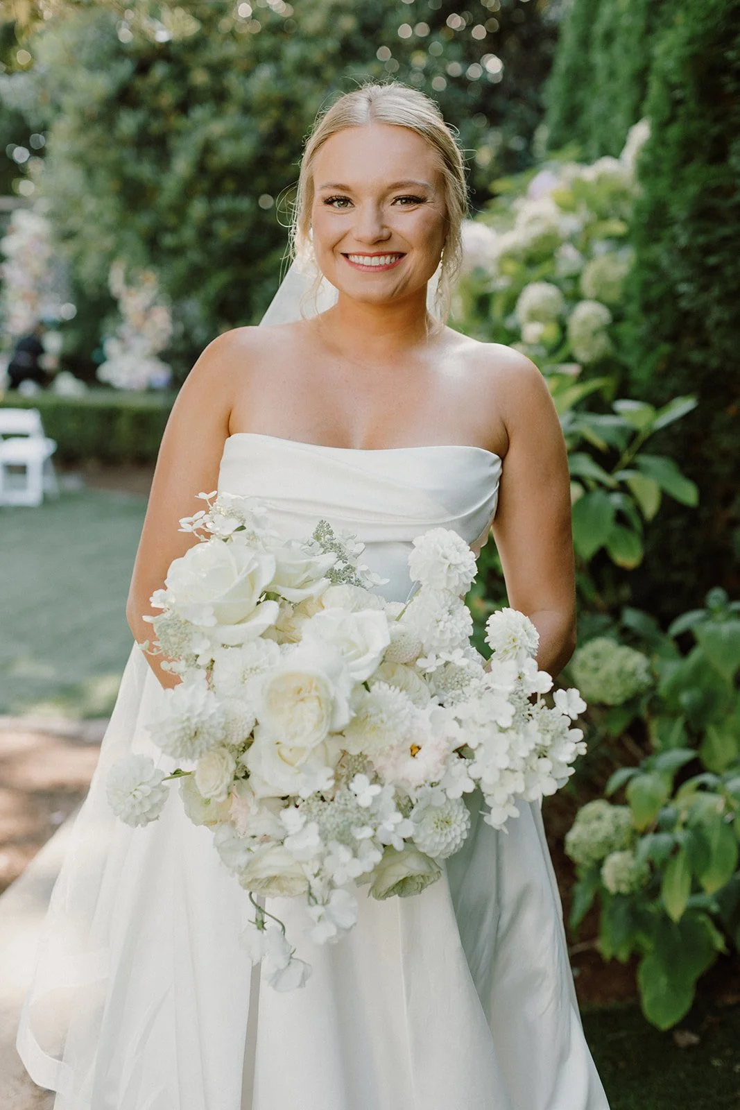 Beautiful Bride Holding Whimsical All White Bridal Bouquet.jpeg