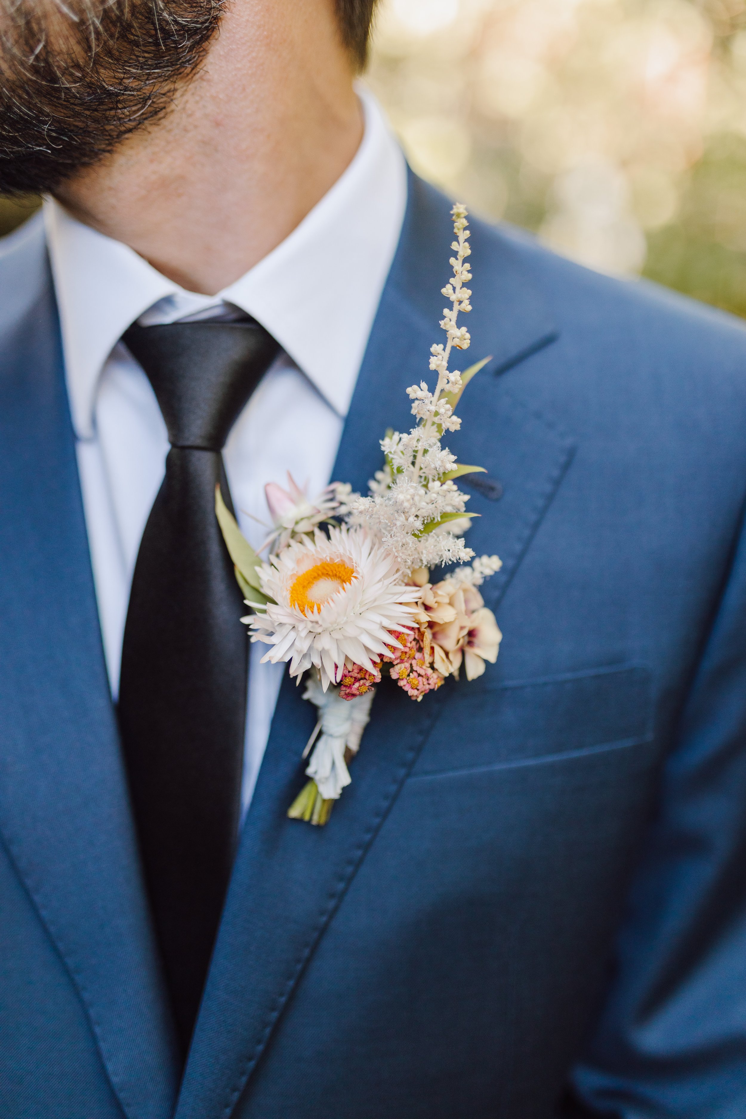 Summery Groom Boutonnière in Peach Palette.jpeg