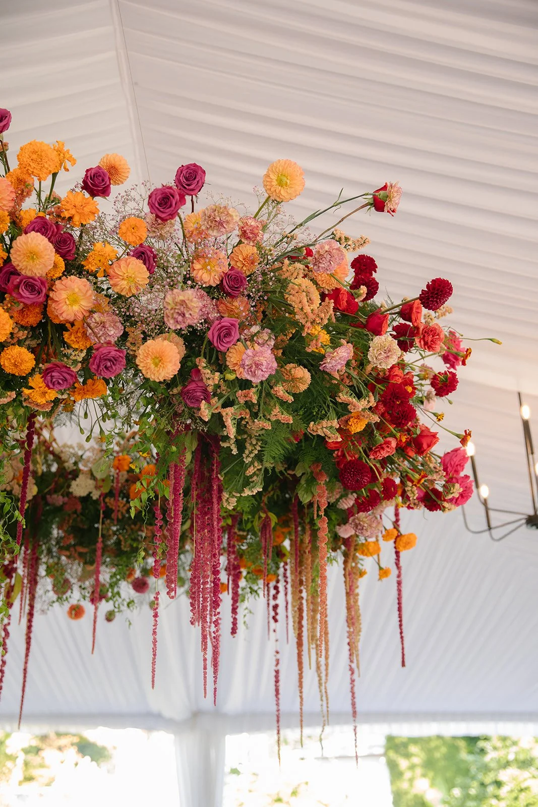 Luxury Tent Florals - Featuring a Large Floral Chandelier with Hanging Amaranth, Dahlias, and Roses.jpeg