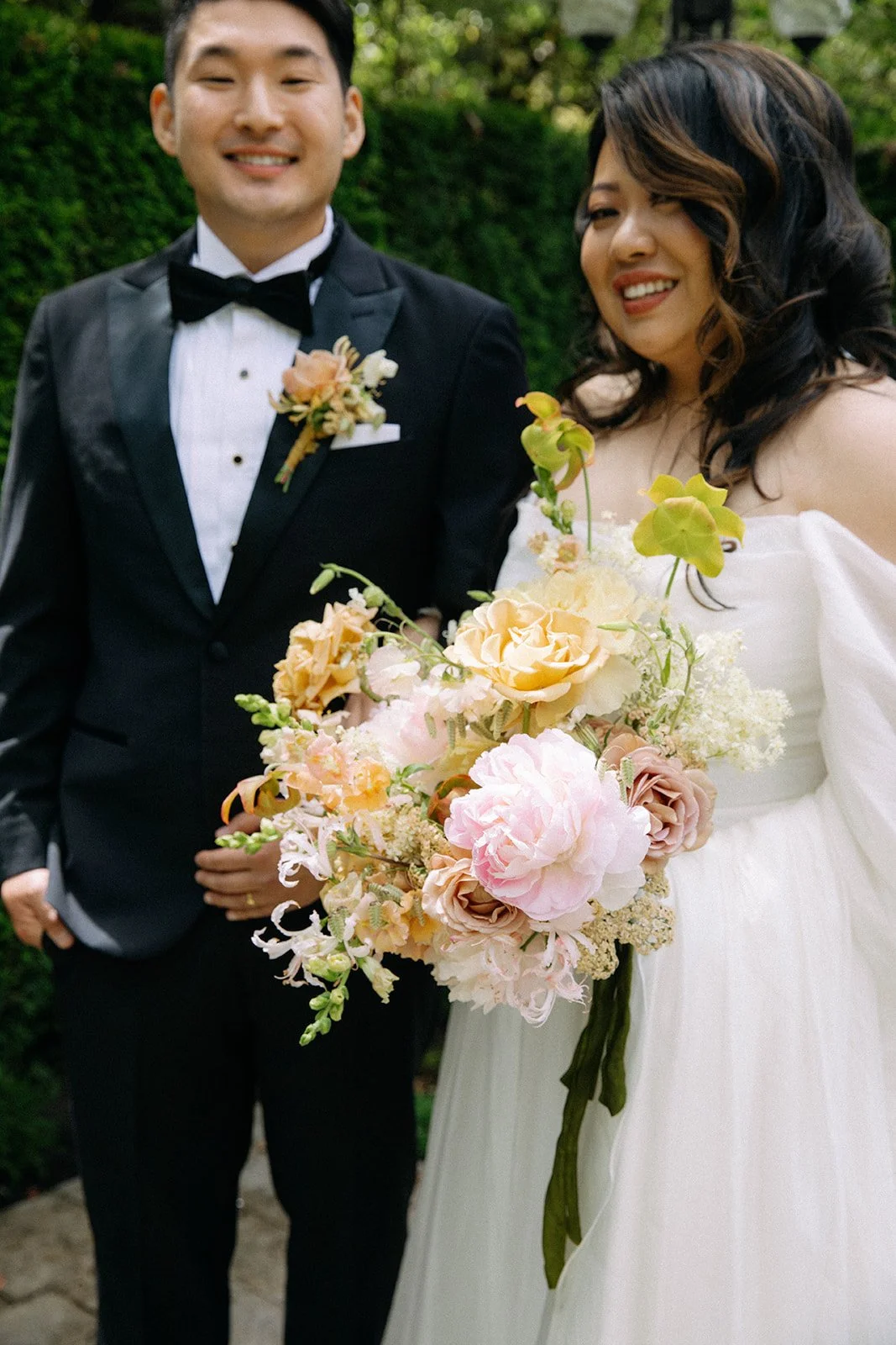 Bride and Groom at Washington Wedding Holding Whimsical Bouquet.jpg