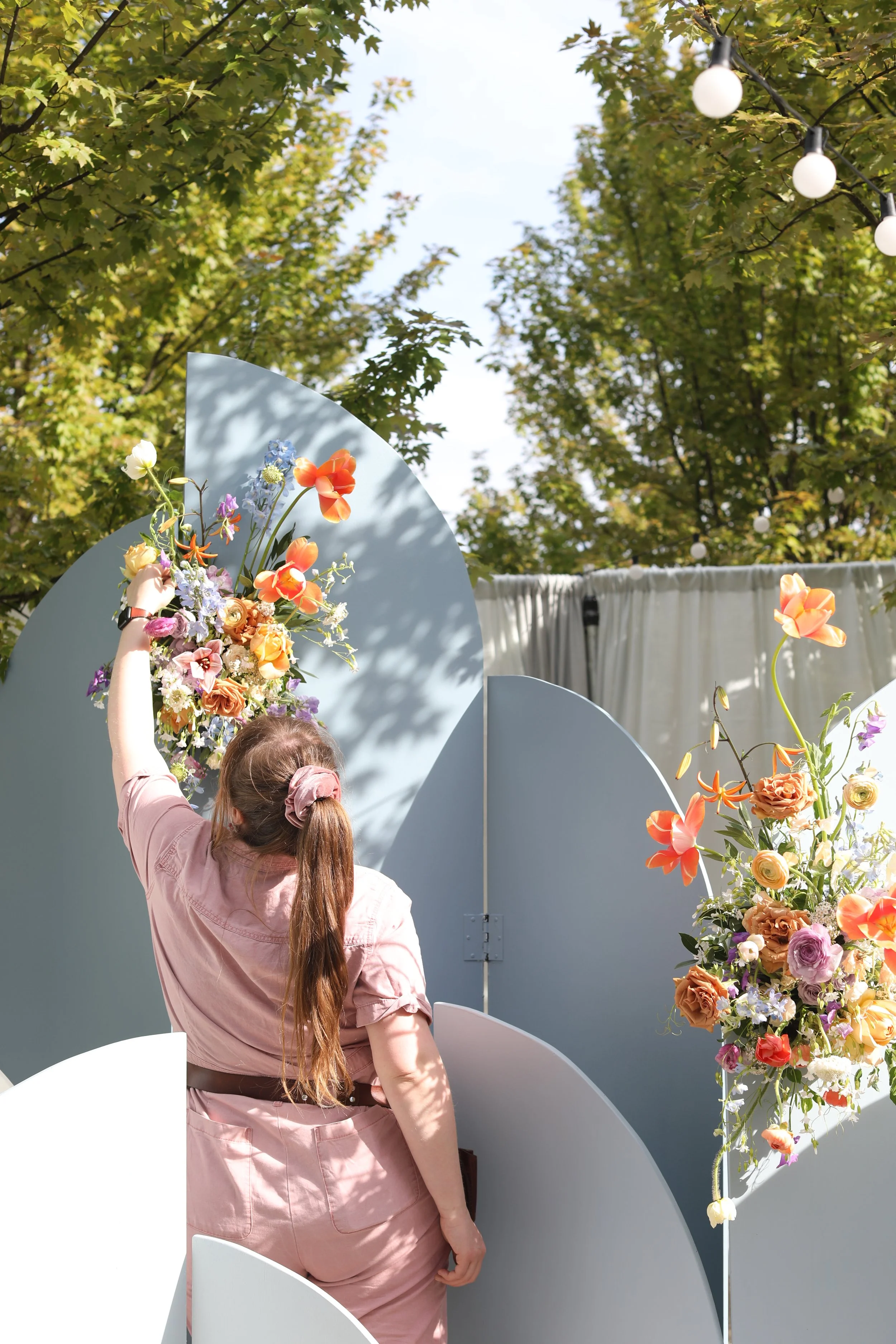 Camile Craig of New Leaf Floral Design Creating Spring Arch Floral Installation.JPG