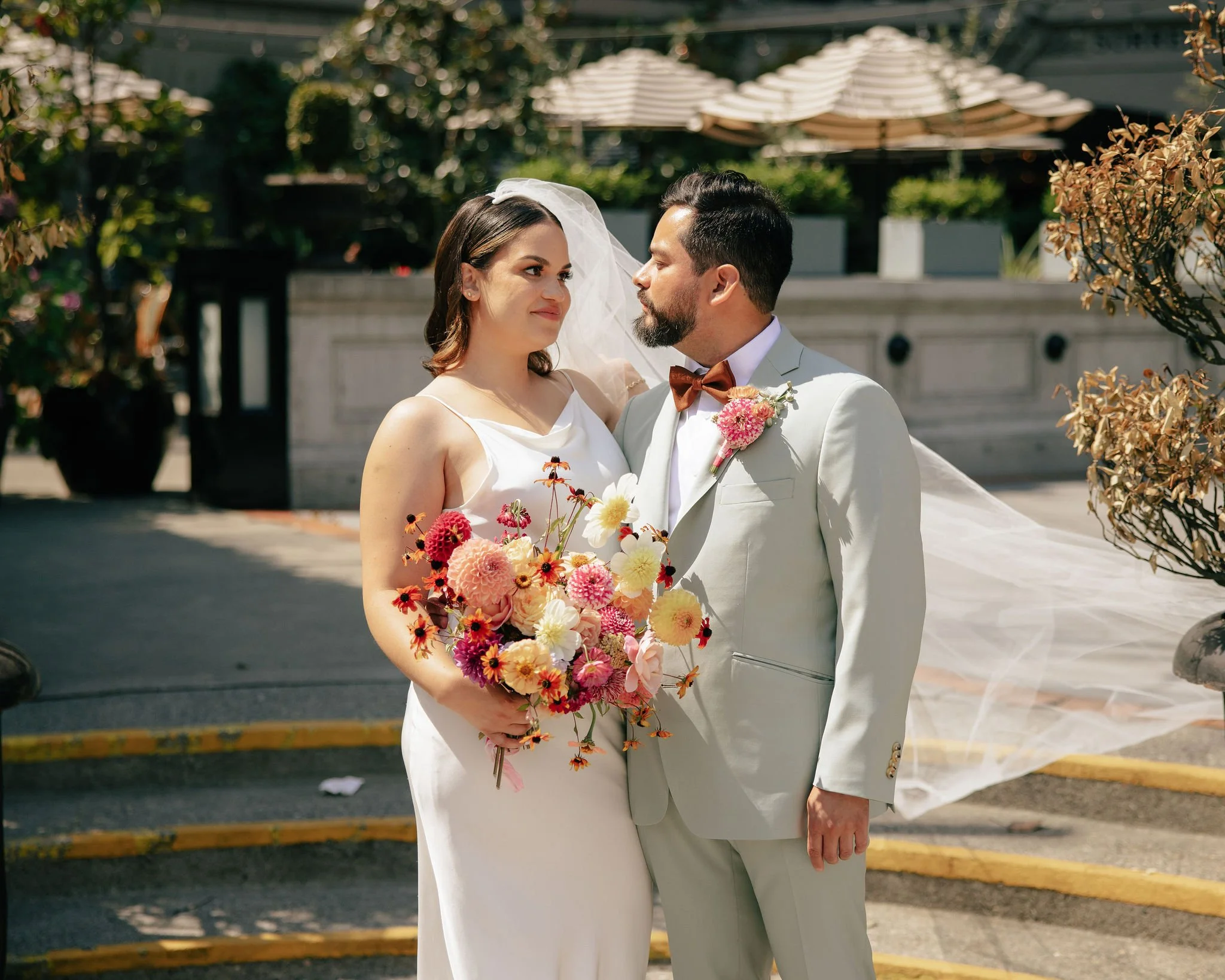 Bride and Groom Enjoy Personal Flowers at Hotel Sorrento Wedding.jpeg