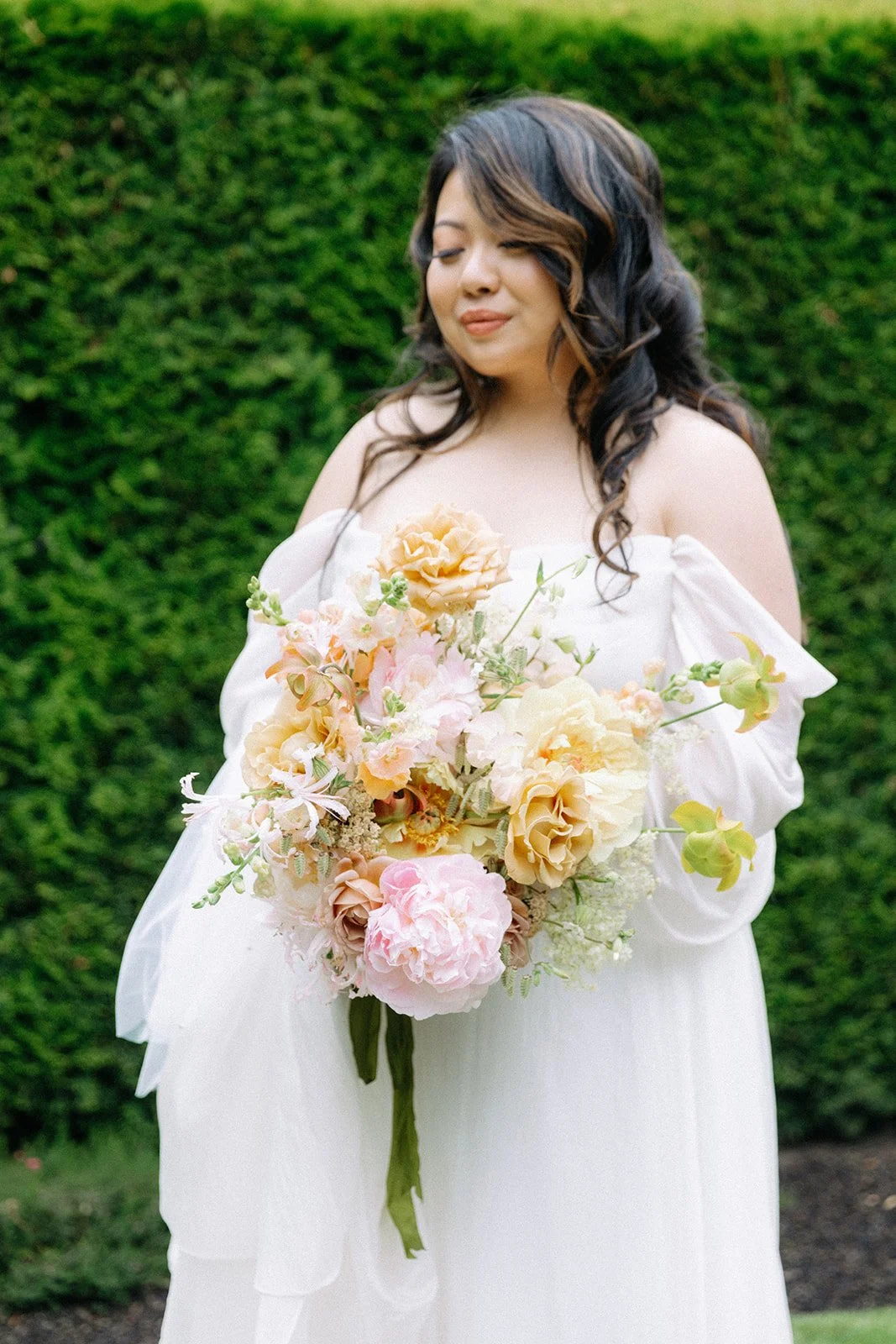 Gorgeous Bride Holding Whimsical Luxury Bridal Bouquet Featuring Peonies.jpg