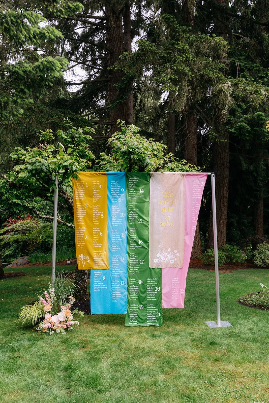 Creative Reception Seating Chart with Grassy Grounded Floral Arrangement.jpg