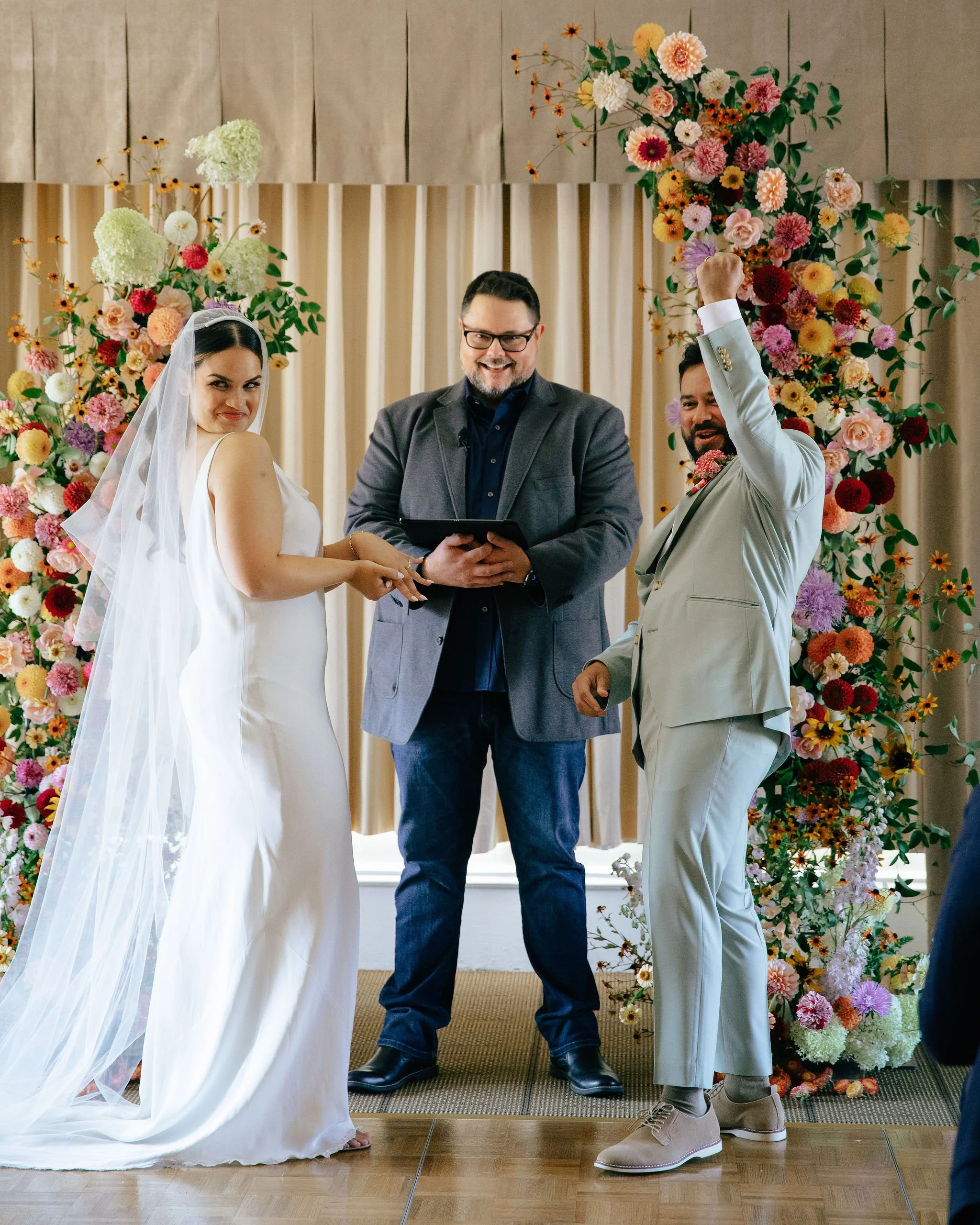 Bright and Colorful Wedding Ceremony Floral Arch in Downtown Seattle.jpeg
