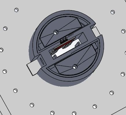  The seed compartment houses the seed dispensing system actuated by small solenoids that act as gate valves, and the soil moisture sensor that protrudes 1” below the module to take humidity readings from the soil.  