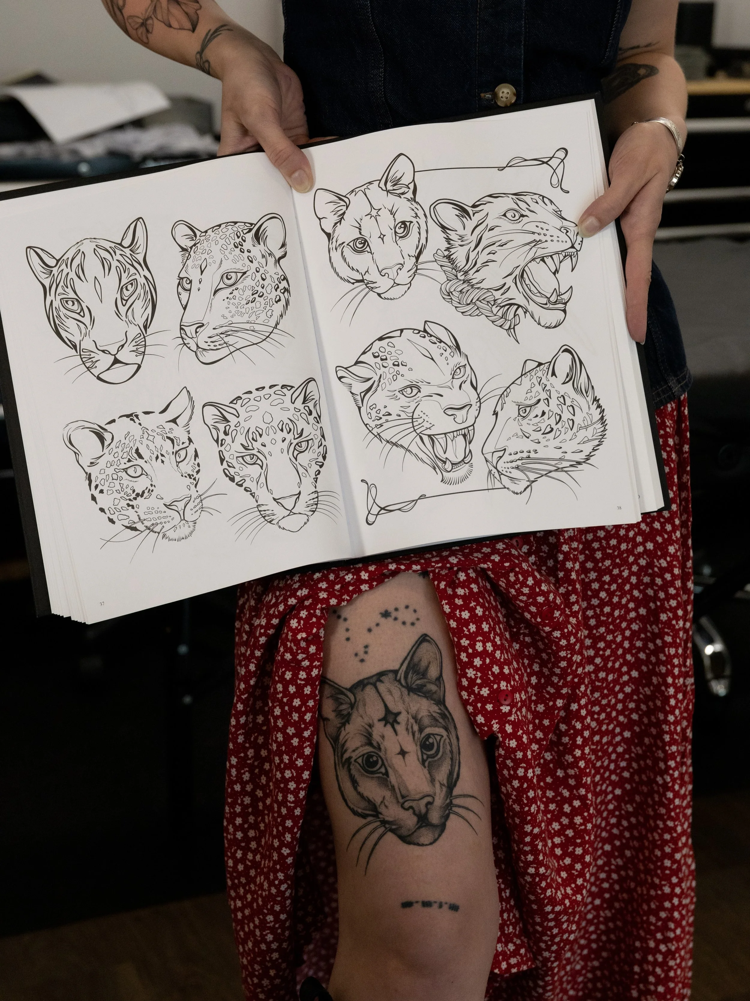 From design &rarr; skin &rarr; paper.

These pieces lived first on the bodies that hold Day 1&ndash;Day 6, and now they live again inside the Day Seven coloring book. Come experience the living art show, meet the people carrying the work, and color t