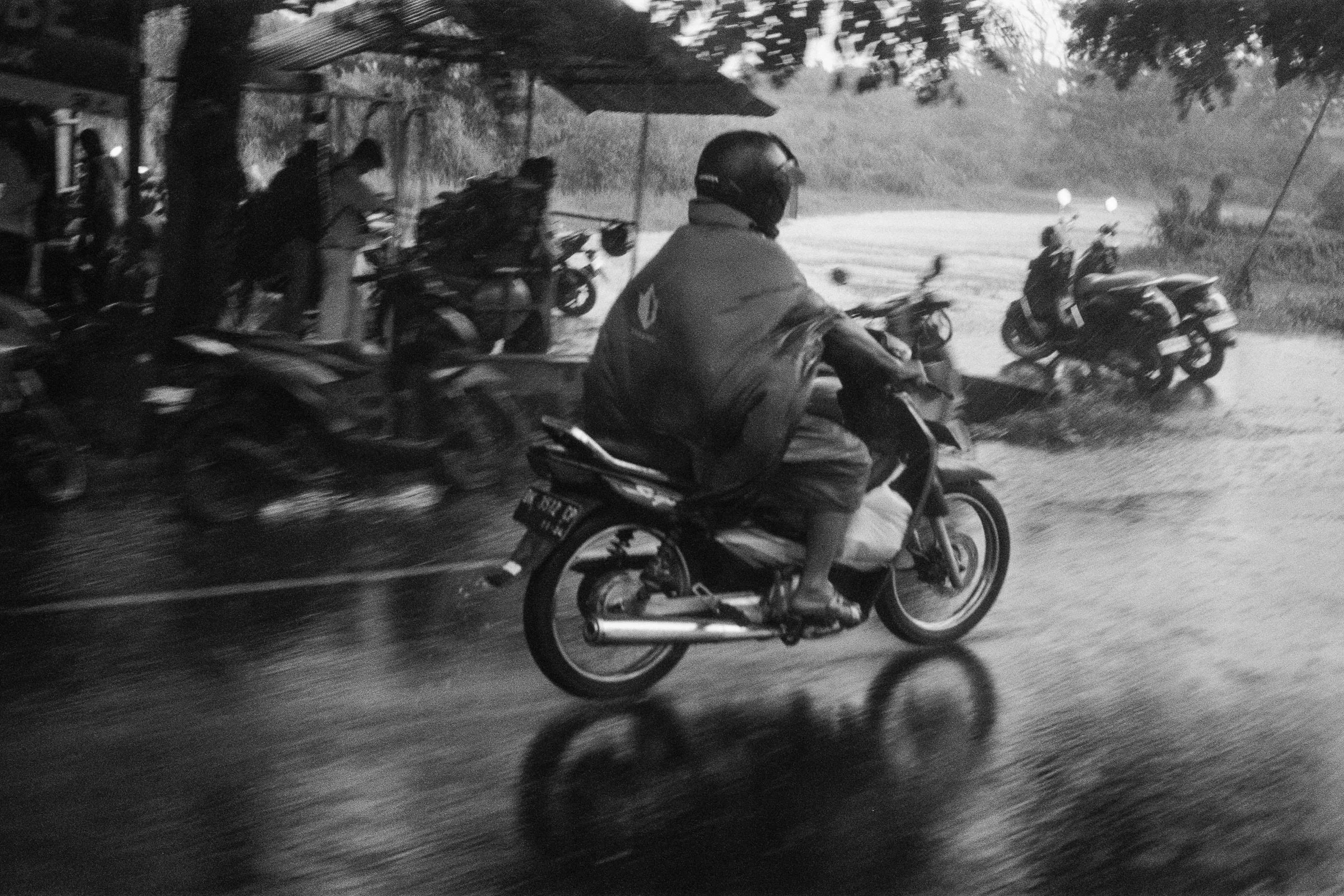 17-11CY

Denpasar in a day, Rain, Dank &amp; Sunshine.
Within minutes, ice delivered before the storm,
rained in with a large side of brain freeze. 
Finished with a gorgeous sunset,facing west; lavender, oranges and golds on show, on black and white 