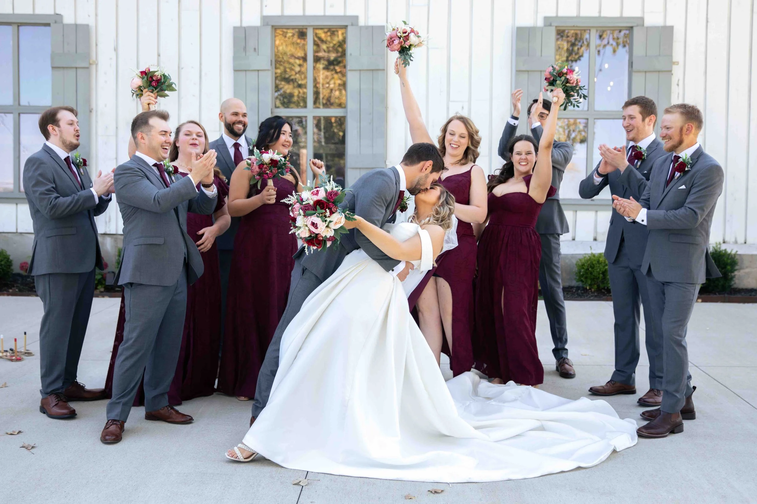 Bridal party cheering for bride and groom