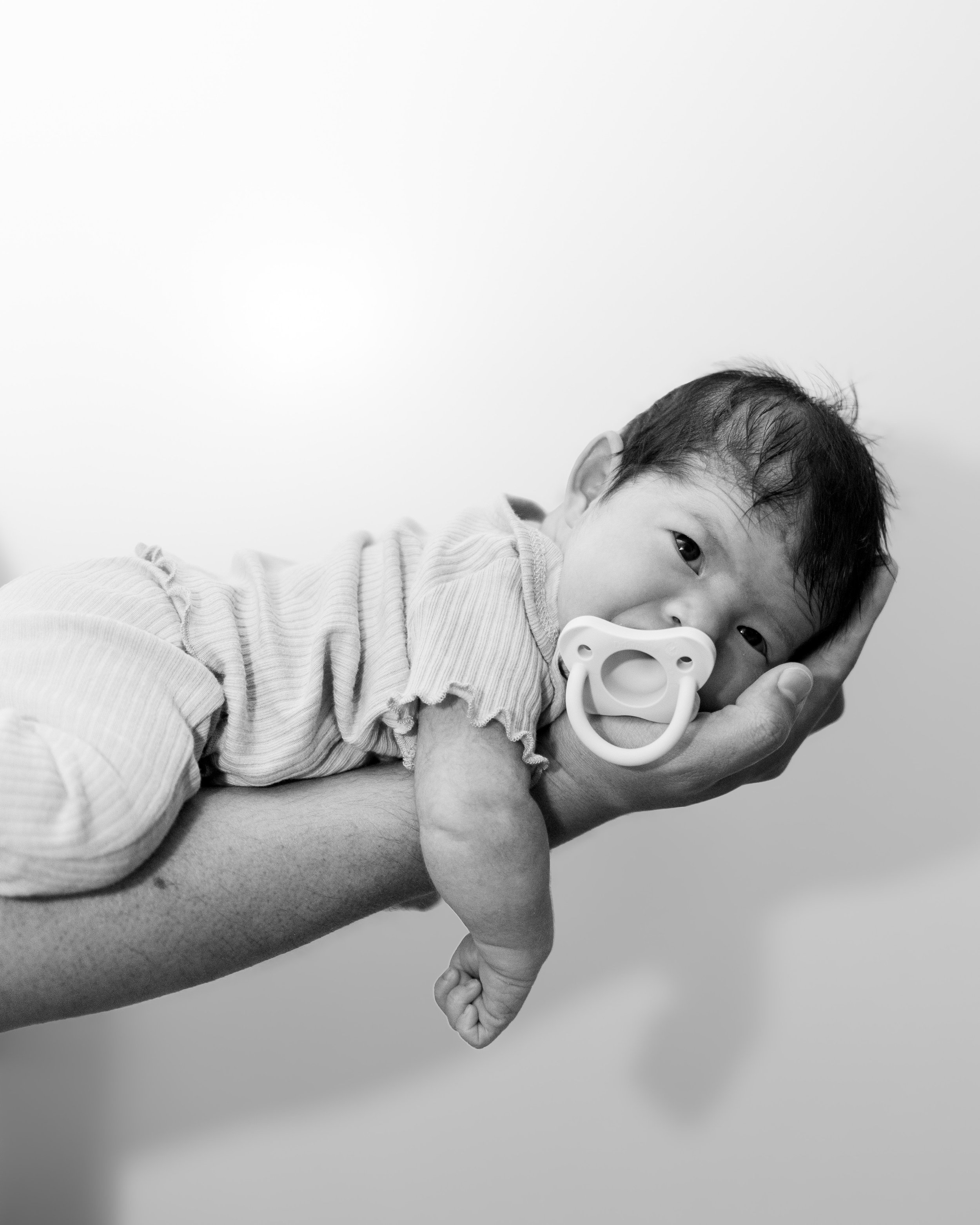 black and white photo of a new born baby