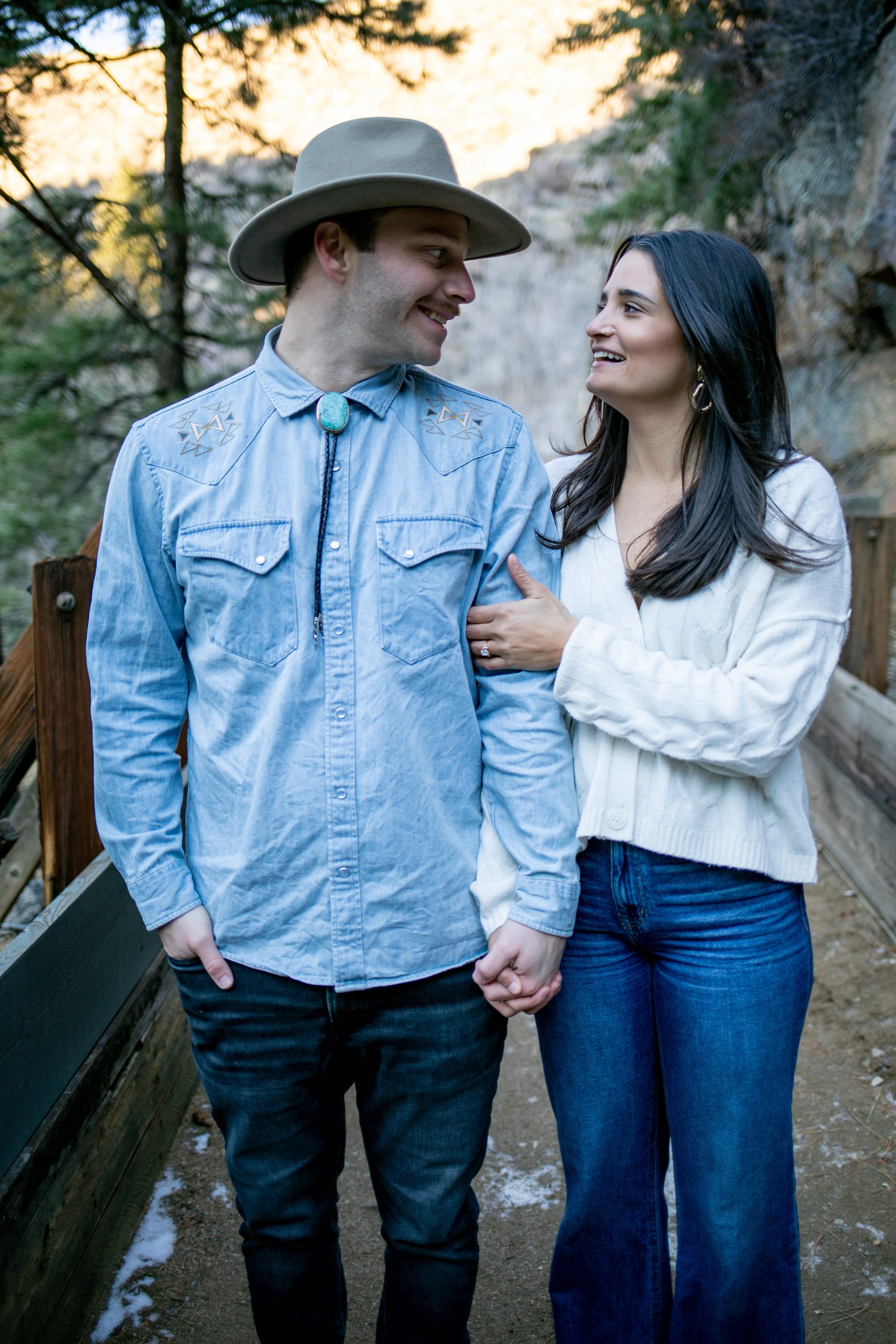newly engaged couple holding eachother
