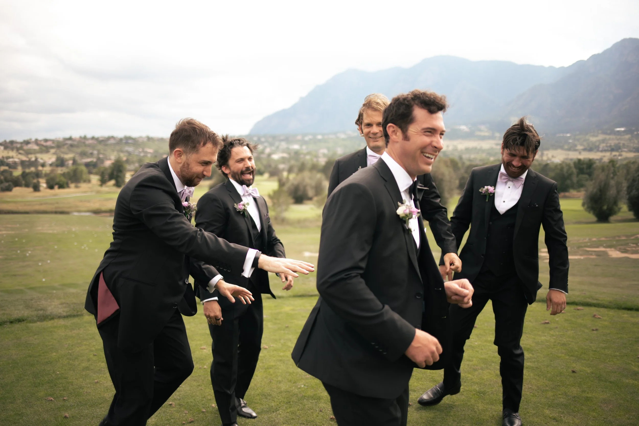 groom and groomsmen laughing